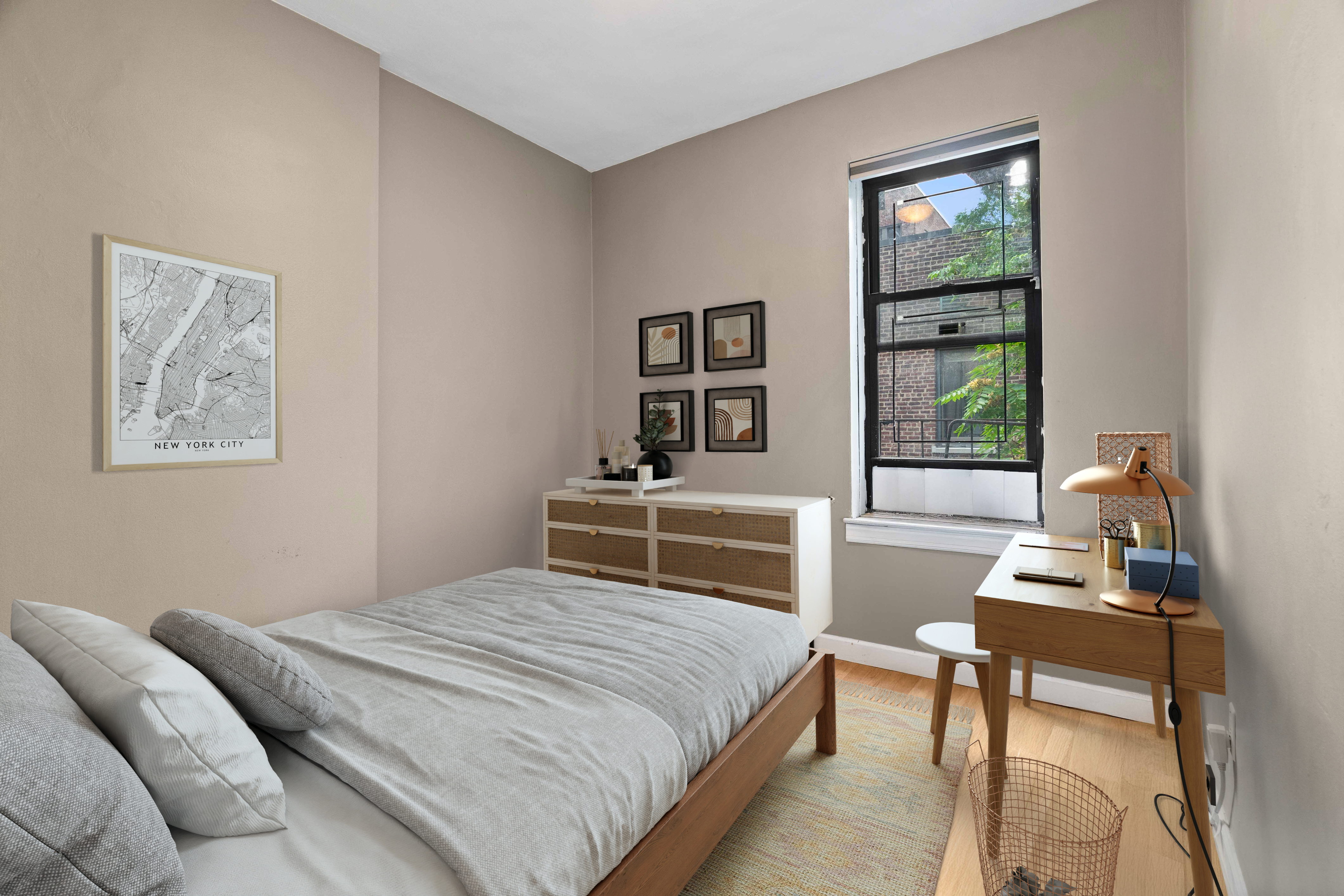 348 West 56th Street, Unit 5B Manhattan, NY 10019 - Photo 2 of 4 a bedroom with a bed a bookshelf a desk and chair