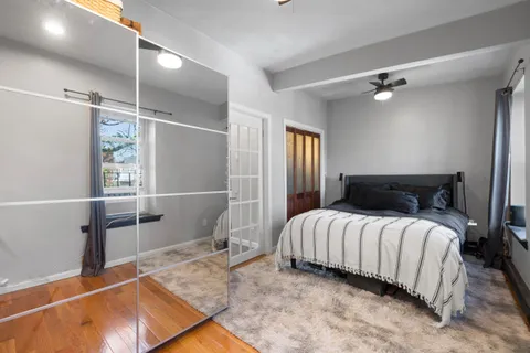 a bedroom with a bed and walk in closet