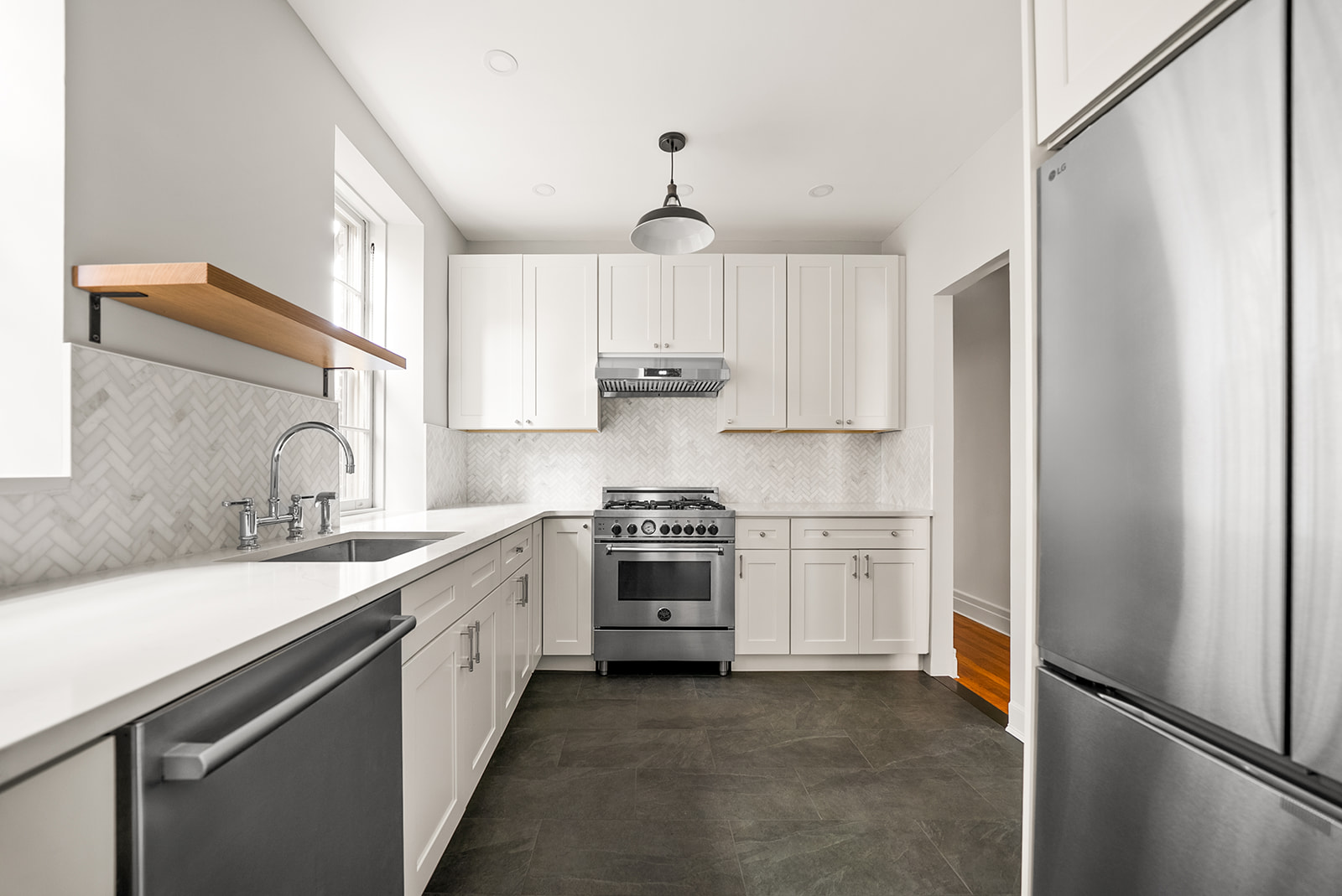 34-13 80th Street, Unit 31 Queens, NY 11372 - Photo 7 of 16 a kitchen with a sink stove and refrigerator