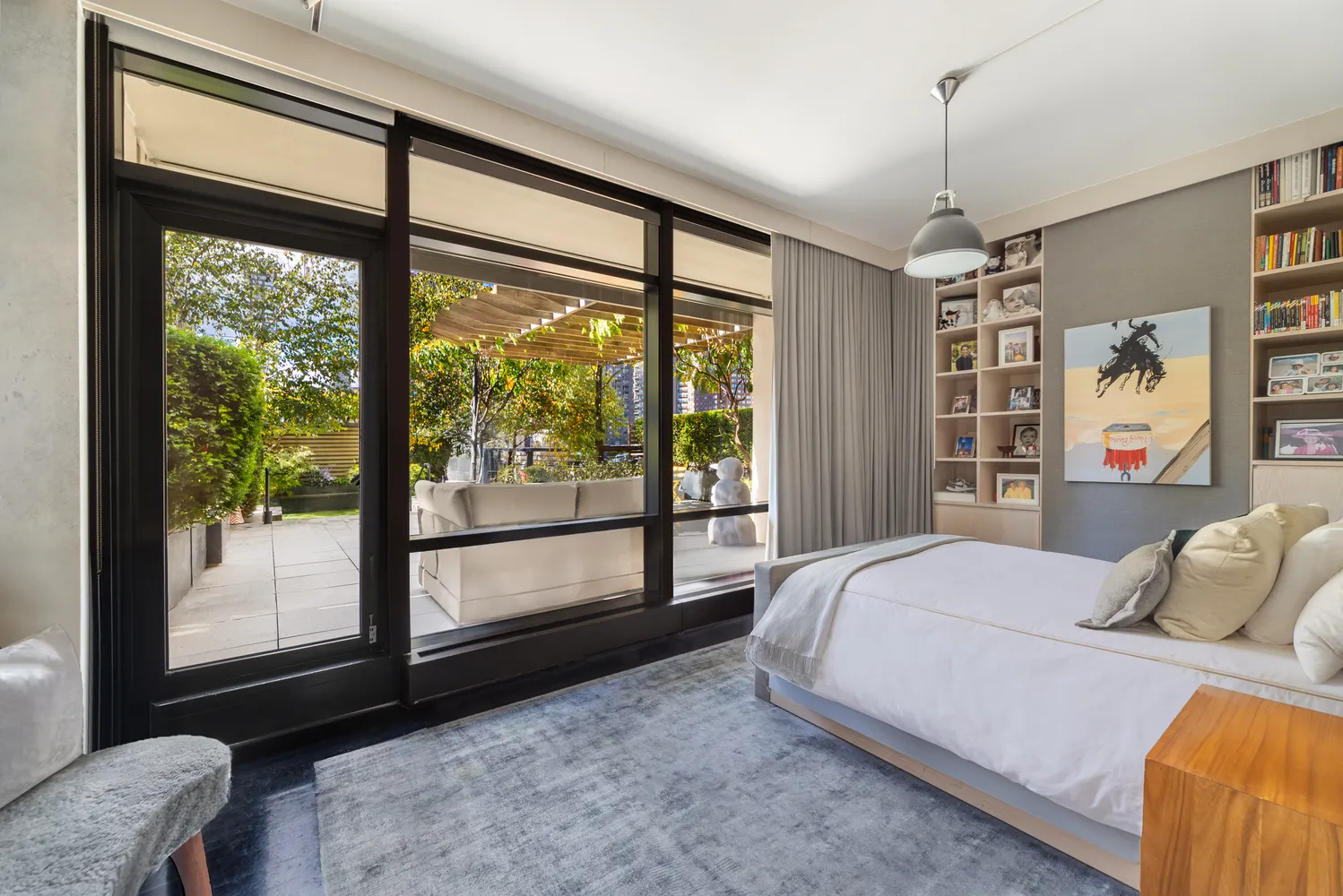 a bedroom with a large bed and a large window