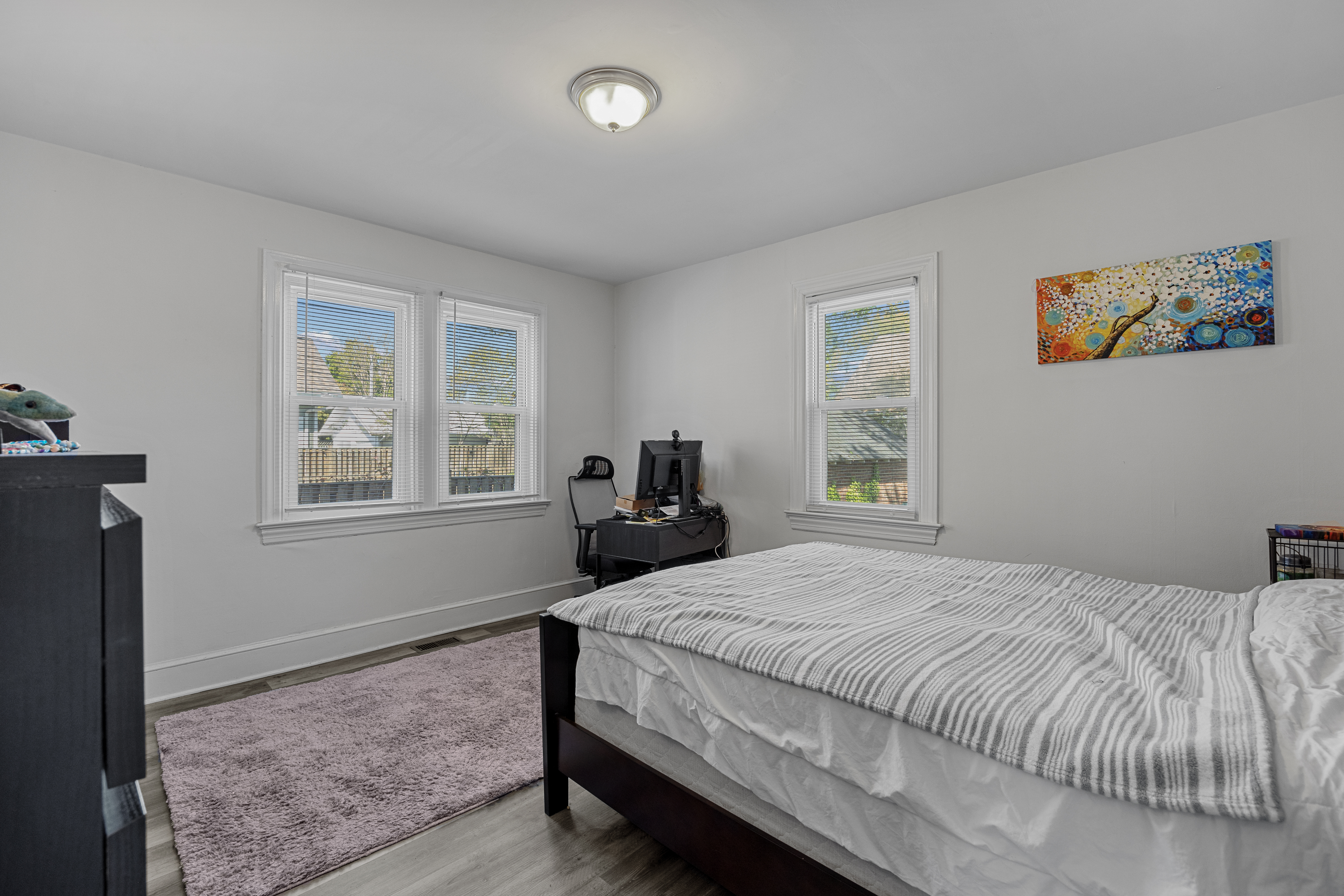 34 East Walnut Street Alexandria, VA 22301 - Photo 8 of 15 a bedroom with a bed and wooden floor
