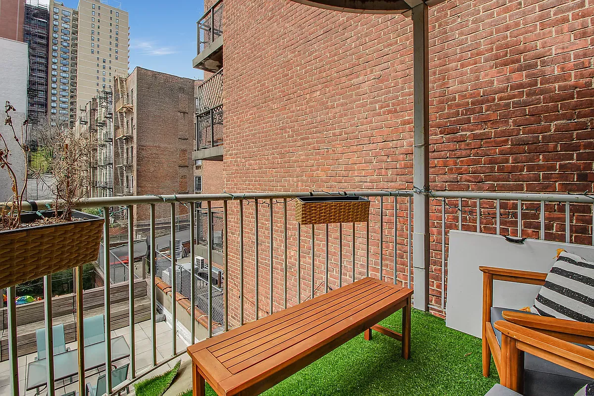 1569 2nd Avenue, Unit 301 Manhattan, NY 10028 - Photo 4 of 9 a view of a balcony with a bench