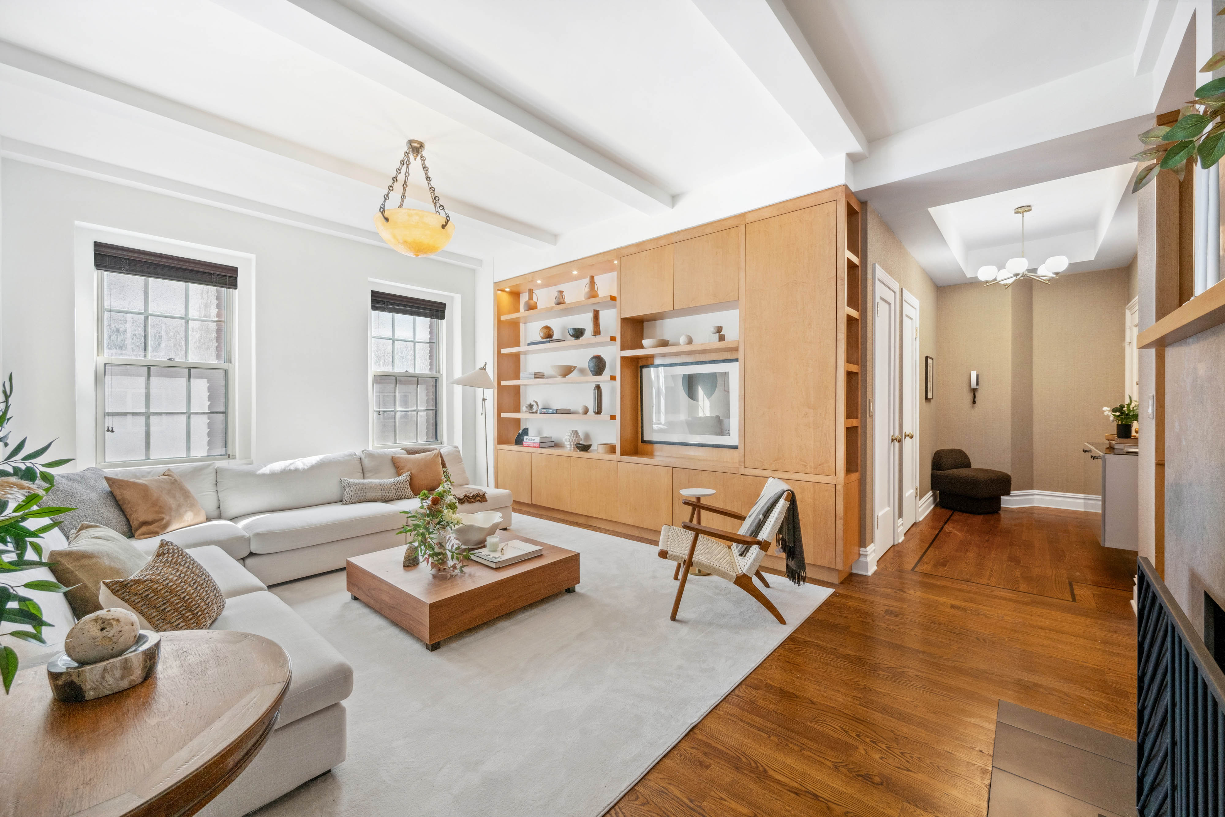 25 5th Avenue, Unit 6C Manhattan, NY 10003 - Photo 1 of 16 a living room with furniture and a table