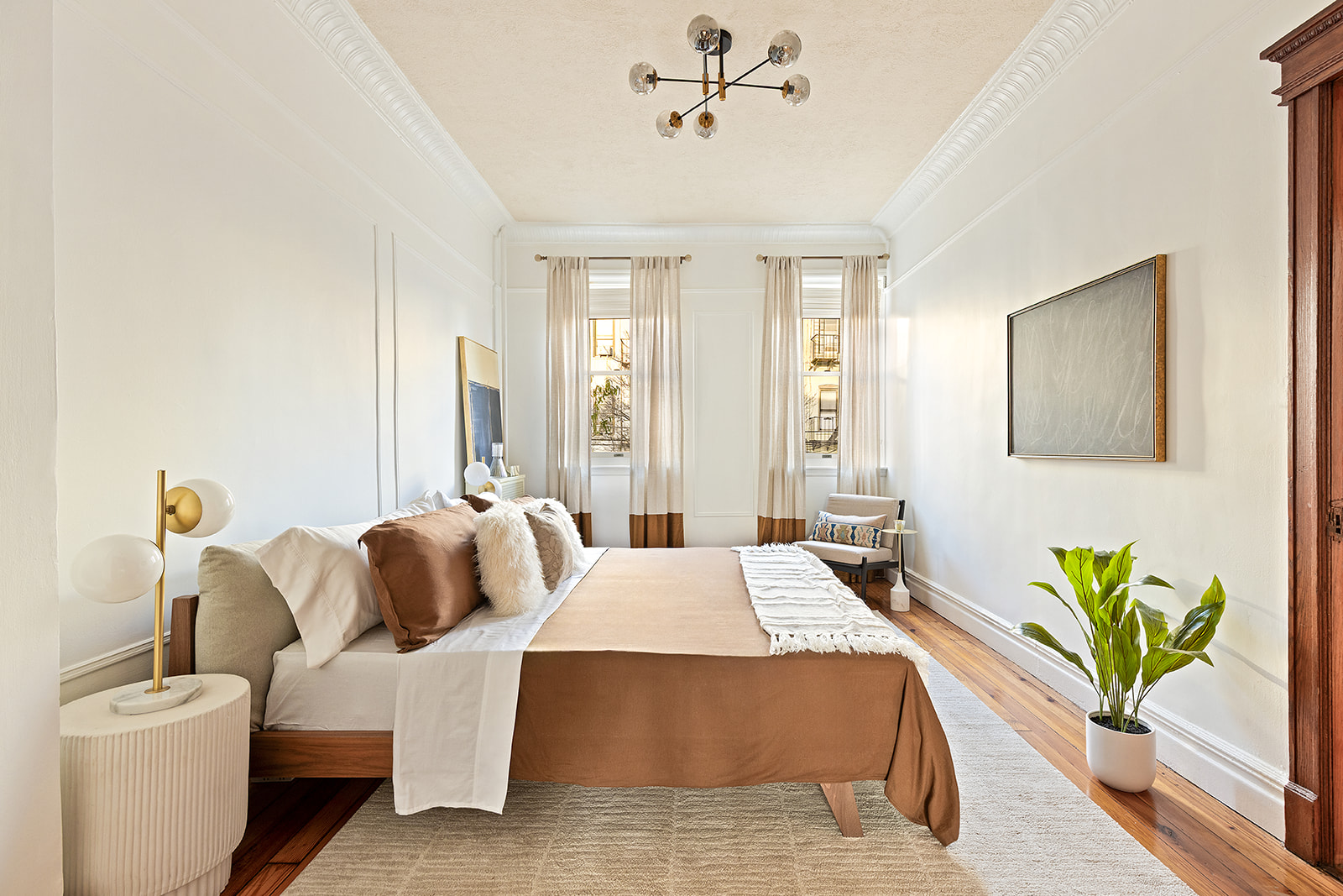 521 84th Street Brooklyn, NY 11209 - Photo 3 of 19 a bedroom with a bed table and couch