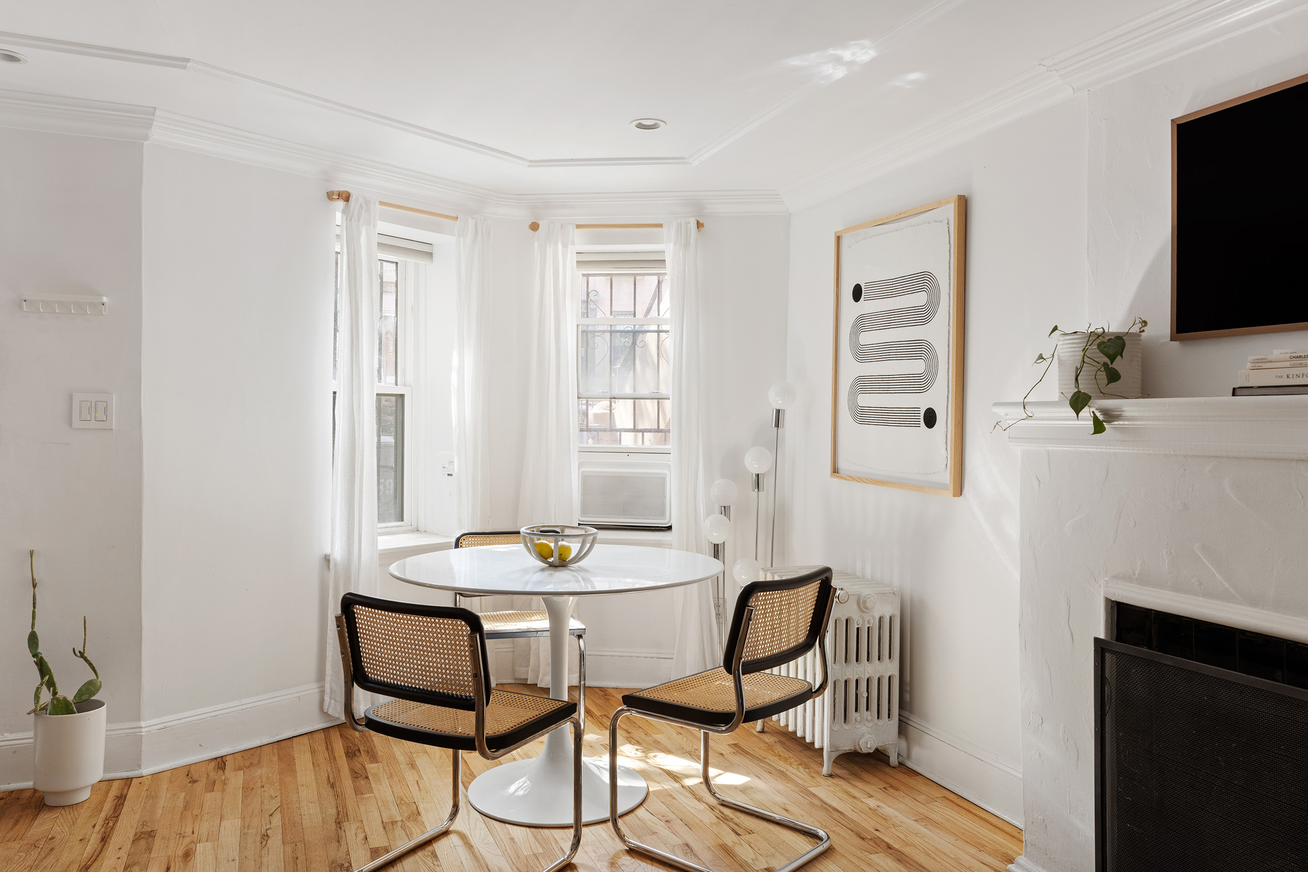 659 Degraw Street, Unit 1 Brooklyn, NY 11217 - Photo 3 of 10 a view of a livingroom with furniture and a flat screen tv