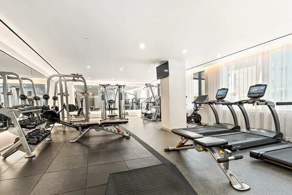 a living room with lots of furniture and windows