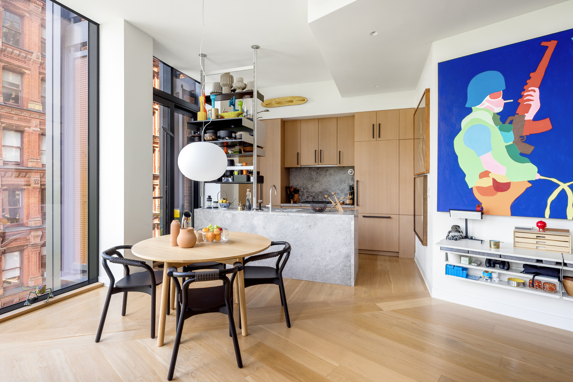 33 Park Row, Unit 6B Manhattan, NY 10038 - Photo 8 of 24 a view of a dining room with furniture and chandelier