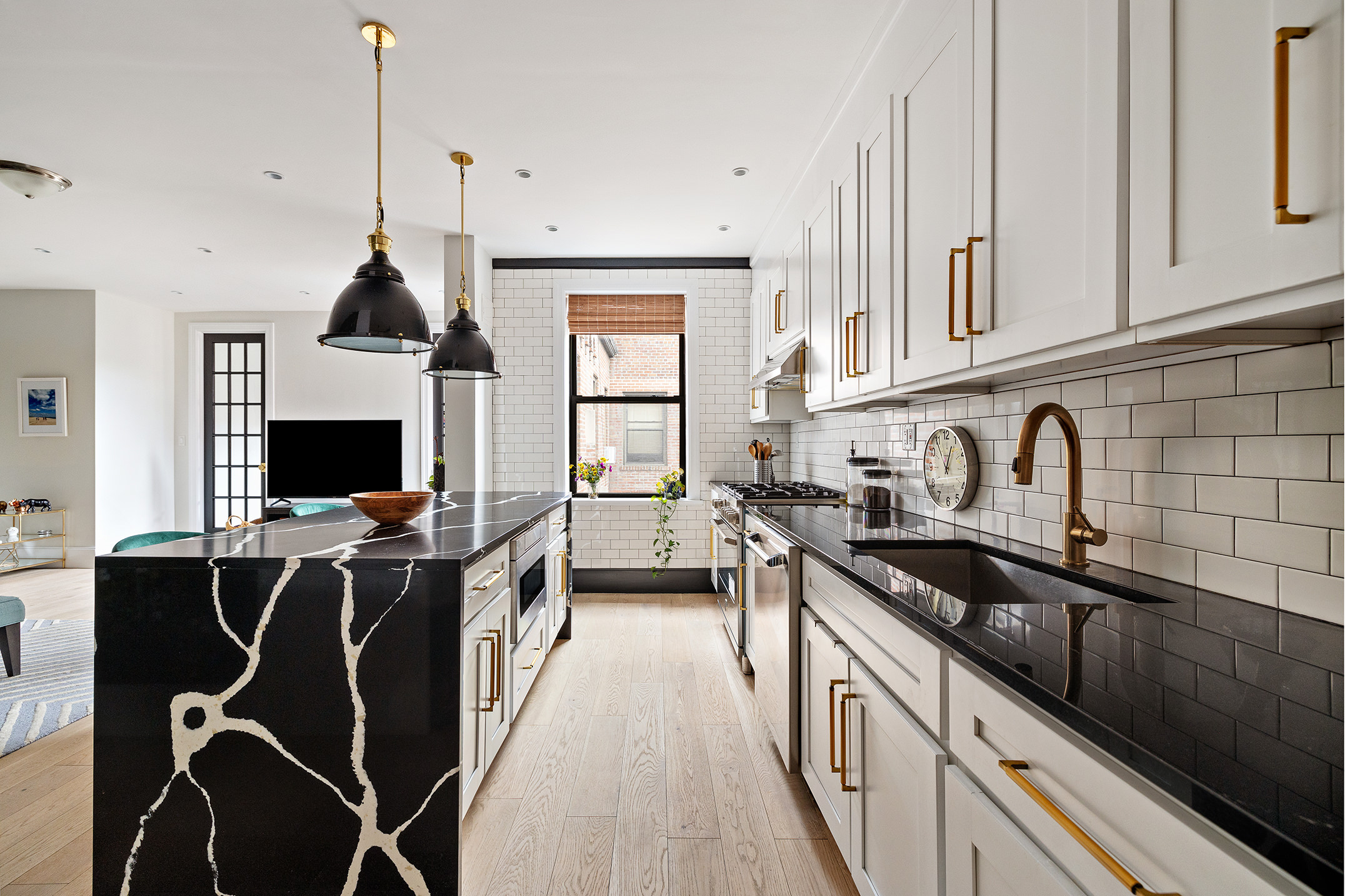163 Ocean Avenue, Unit G6 Brooklyn, NY 11225 - Photo 4 of 12 a kitchen with a sink appliances and cabinets