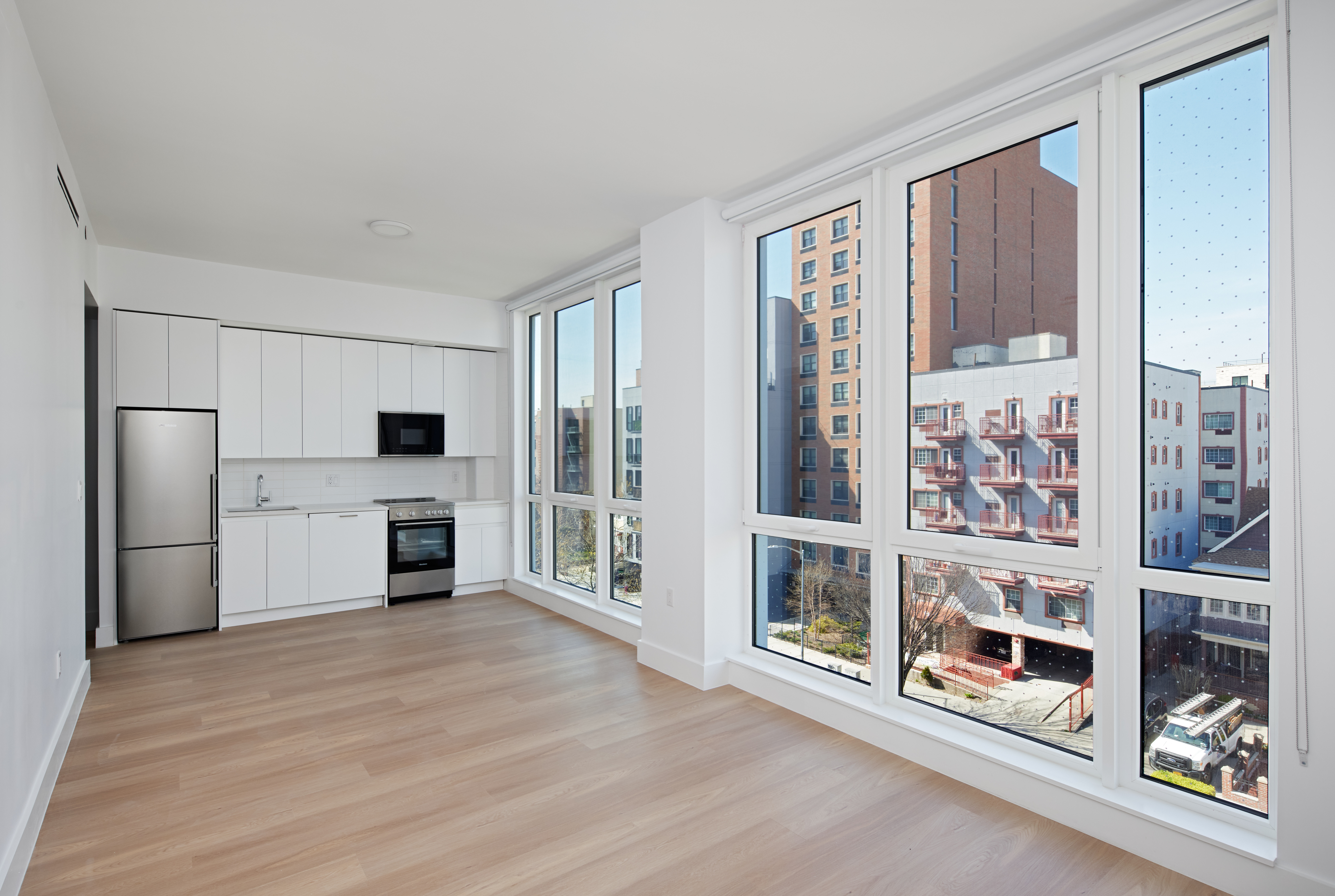 340 Lenox Road, Unit 4C Brooklyn, NY 11226 - Photo 5 of 25 a large kitchen with a stove and a refrigerator