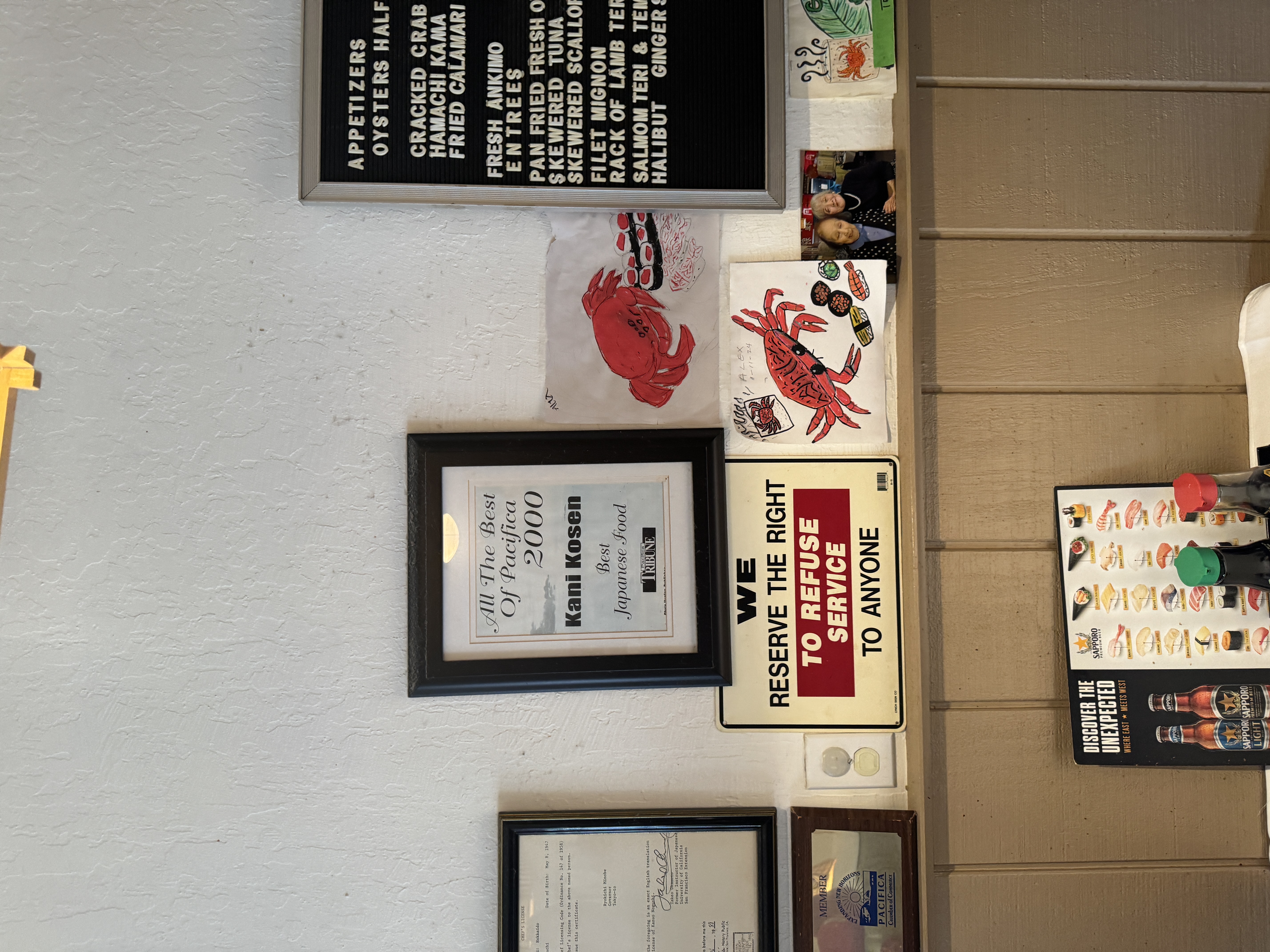 580 Crespi Drive, Unit A Pacifica, CA 94044 - Photo 24 of 25 a group of people sitting on a shelf in a kitchen