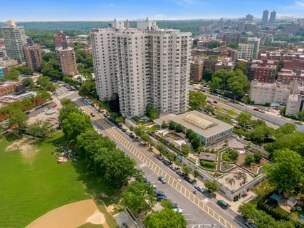 an aerial view of residential houses with outdoor space