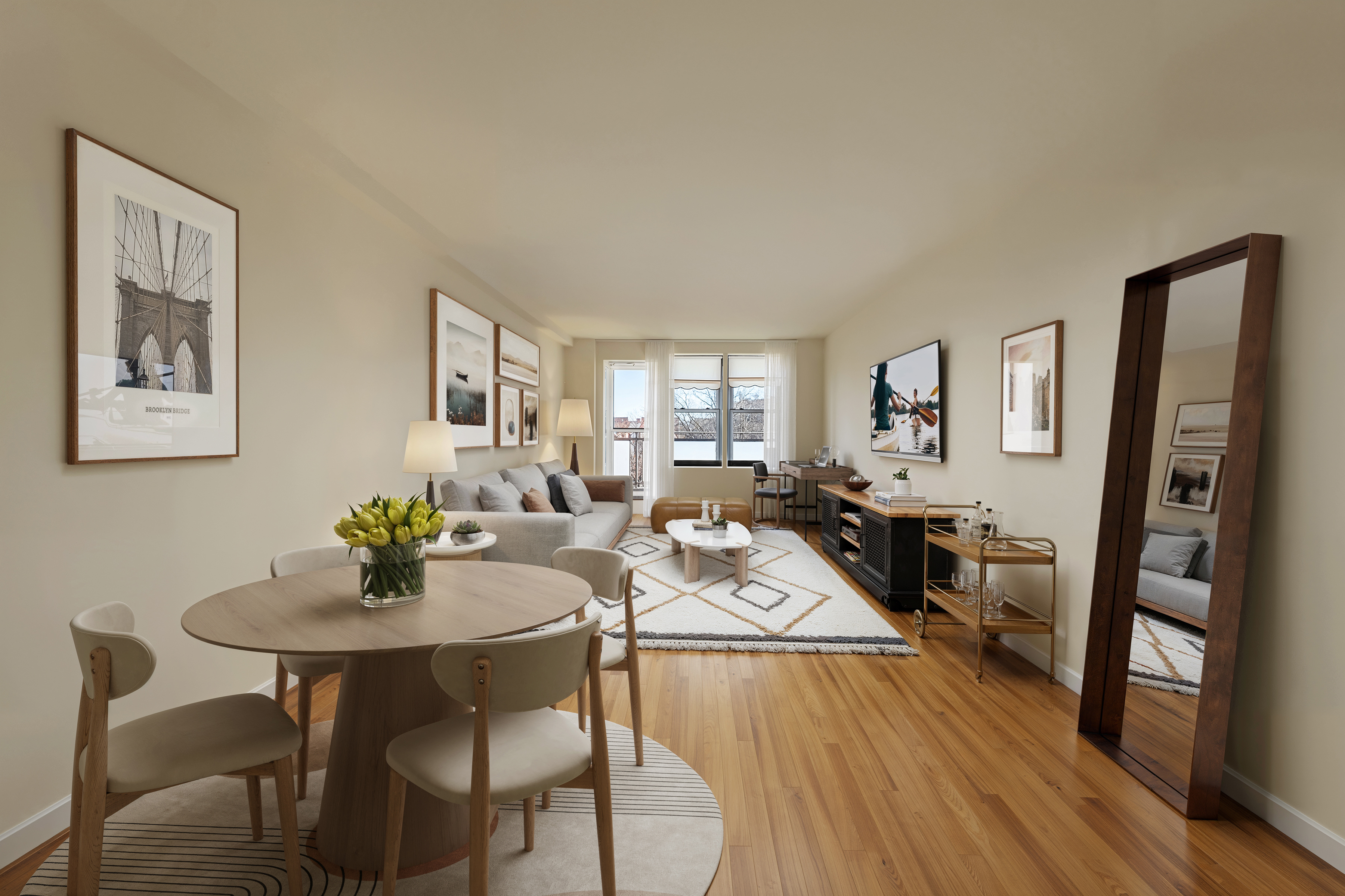 a view of a dining room with furniture a rug and wooden floor