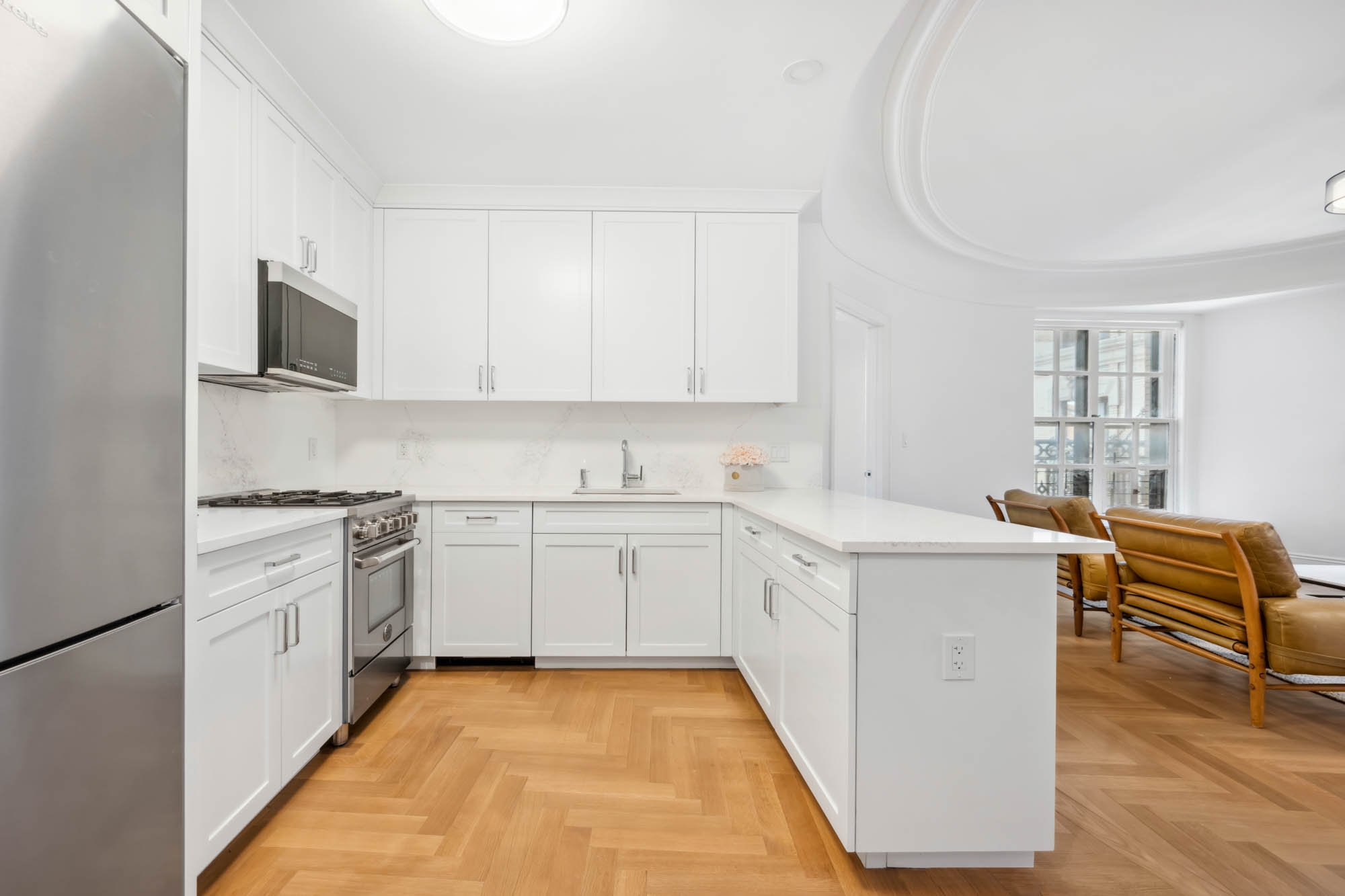 2109 Broadway, Unit 1192 Manhattan, NY 10023 - Photo 3 of 7 a kitchen that has a sink and a stove in it