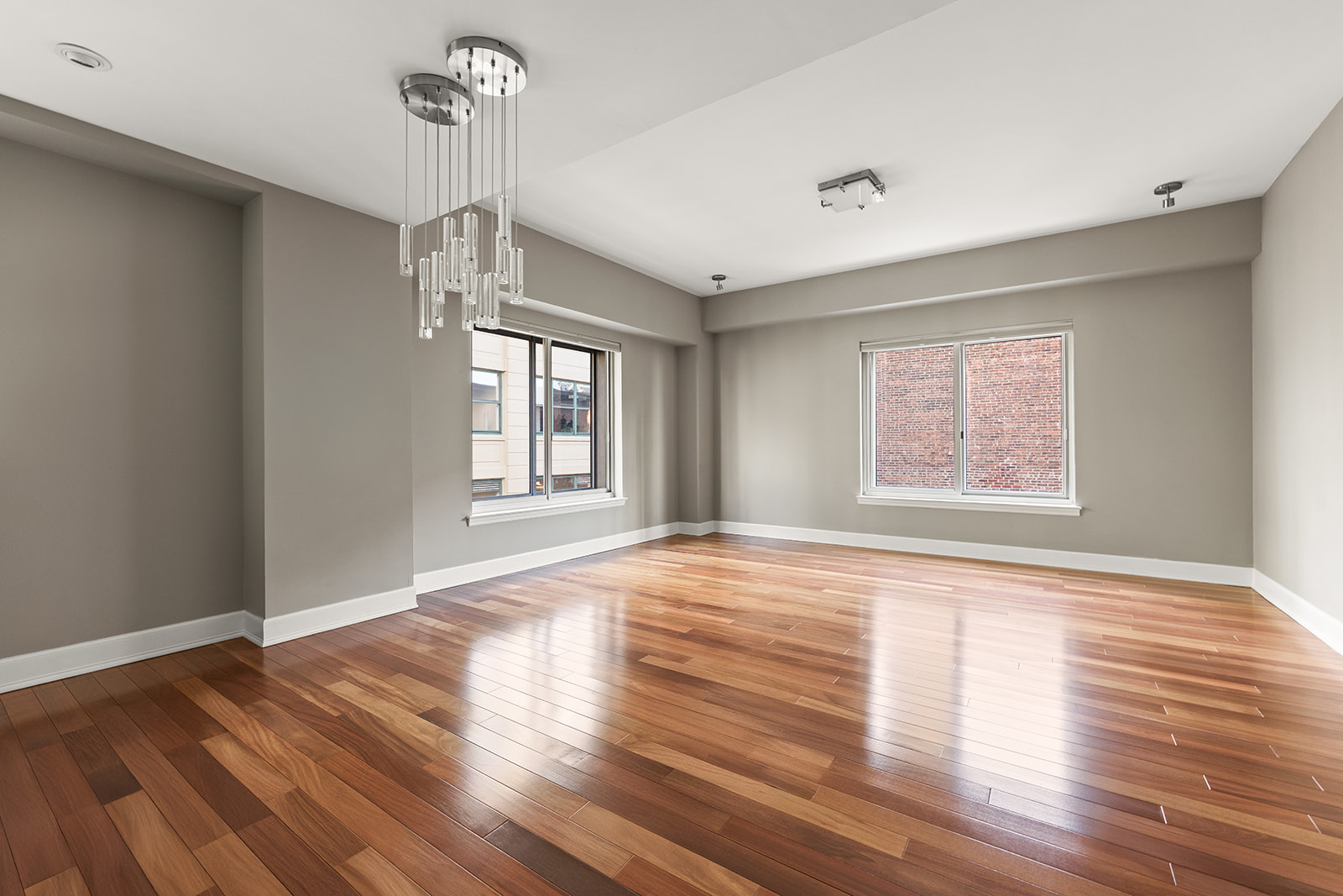 133 Water Street, Unit 8E Brooklyn, NY 11201 - Photo 4 of 16 a view of an empty room with wooden floor and a window
