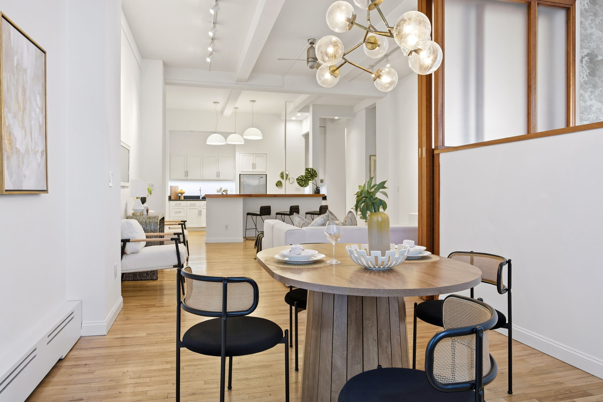 114 East 13th Street, Unit 6B Manhattan, NY 10003 - Photo 6 of 12 a view of a dining room with furniture and wooden floor