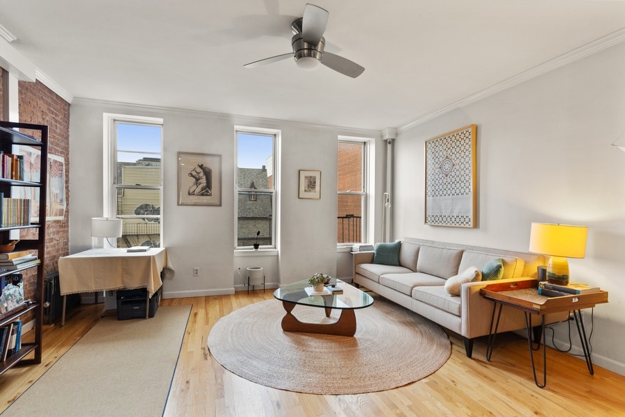 65 Bond Street, Unit 4 Brooklyn, NY 11217 - Photo 2 of 7 a living room with furniture and a dining table