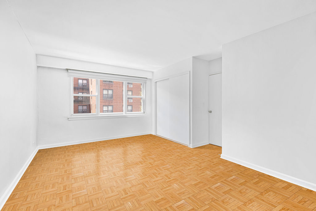101 West 12th Street, Unit 5V Manhattan, NY 10011 - Photo 18 of 26 a view of an empty room with windows