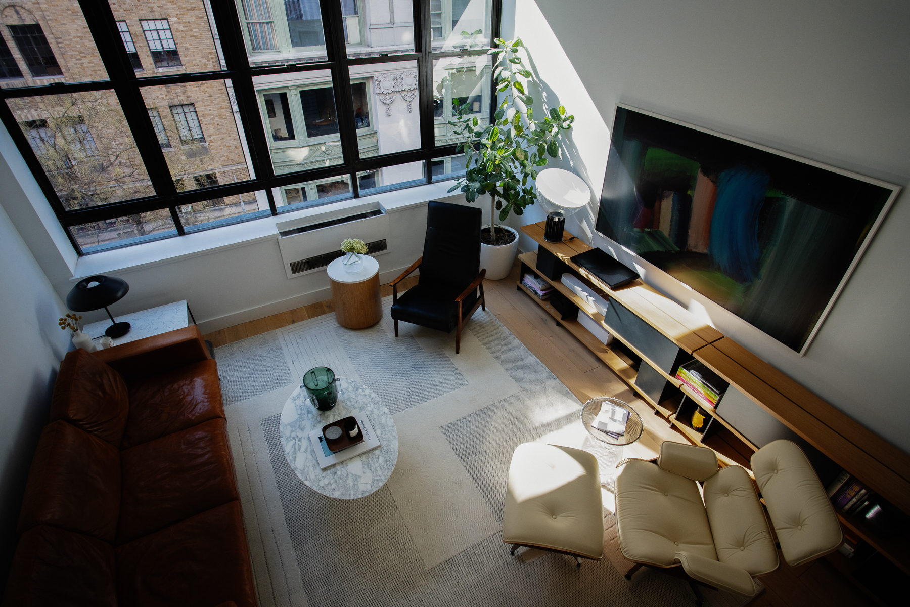 35 East 10th Street, Unit 4J Manhattan, NY 10003 - Photo 7 of 19 a living room with furniture
