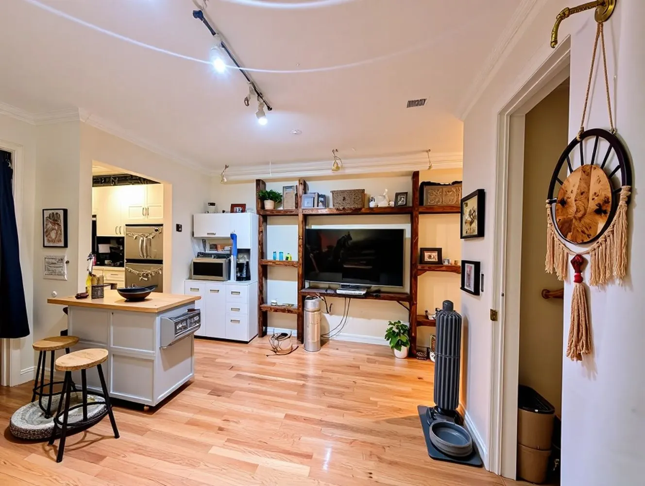 a view of a livingroom with furniture and a flat screen tv
