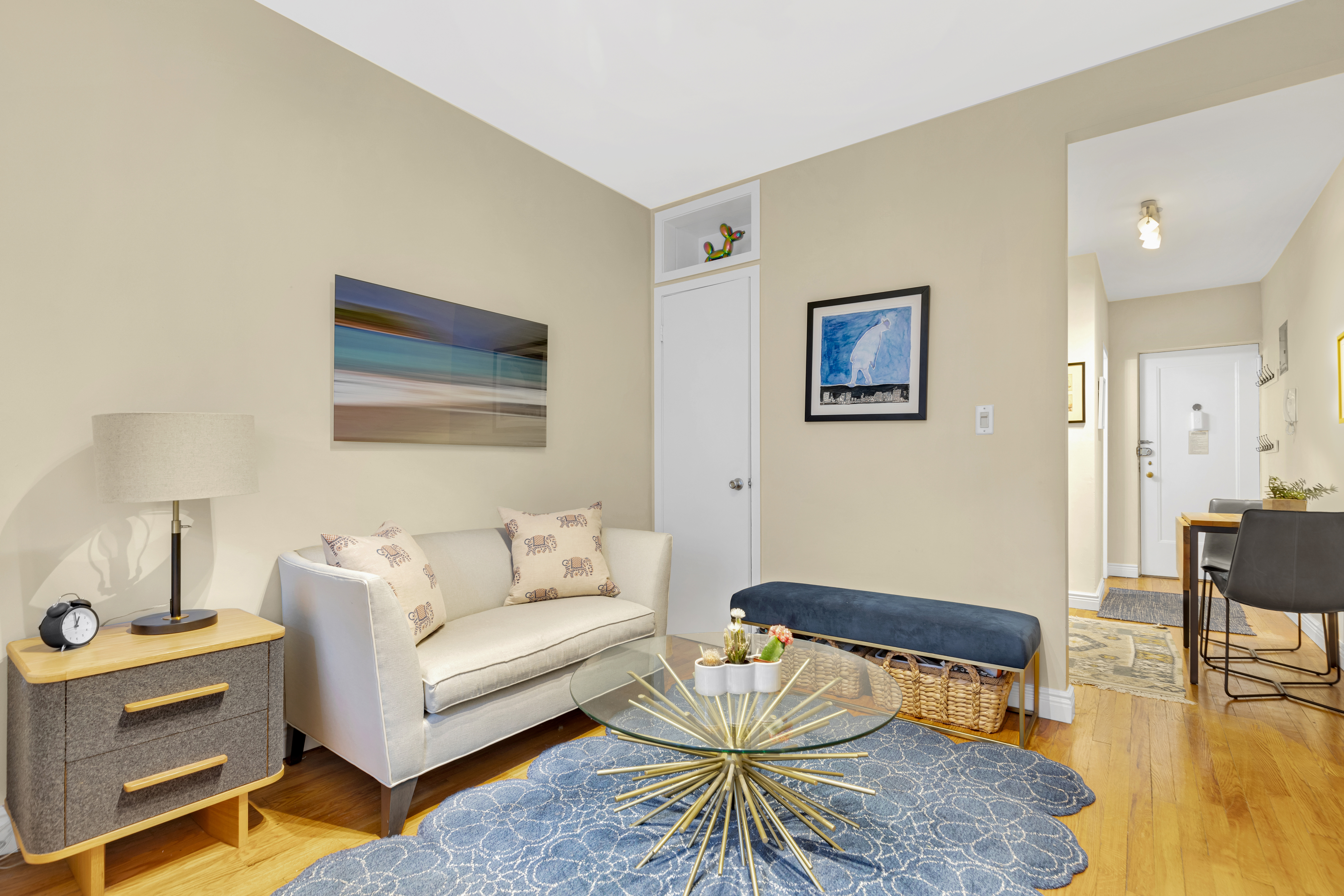 312 West 23rd Street, Unit 3R Manhattan, NY 10011 - Photo 2 of 6 a living room with furniture and a table