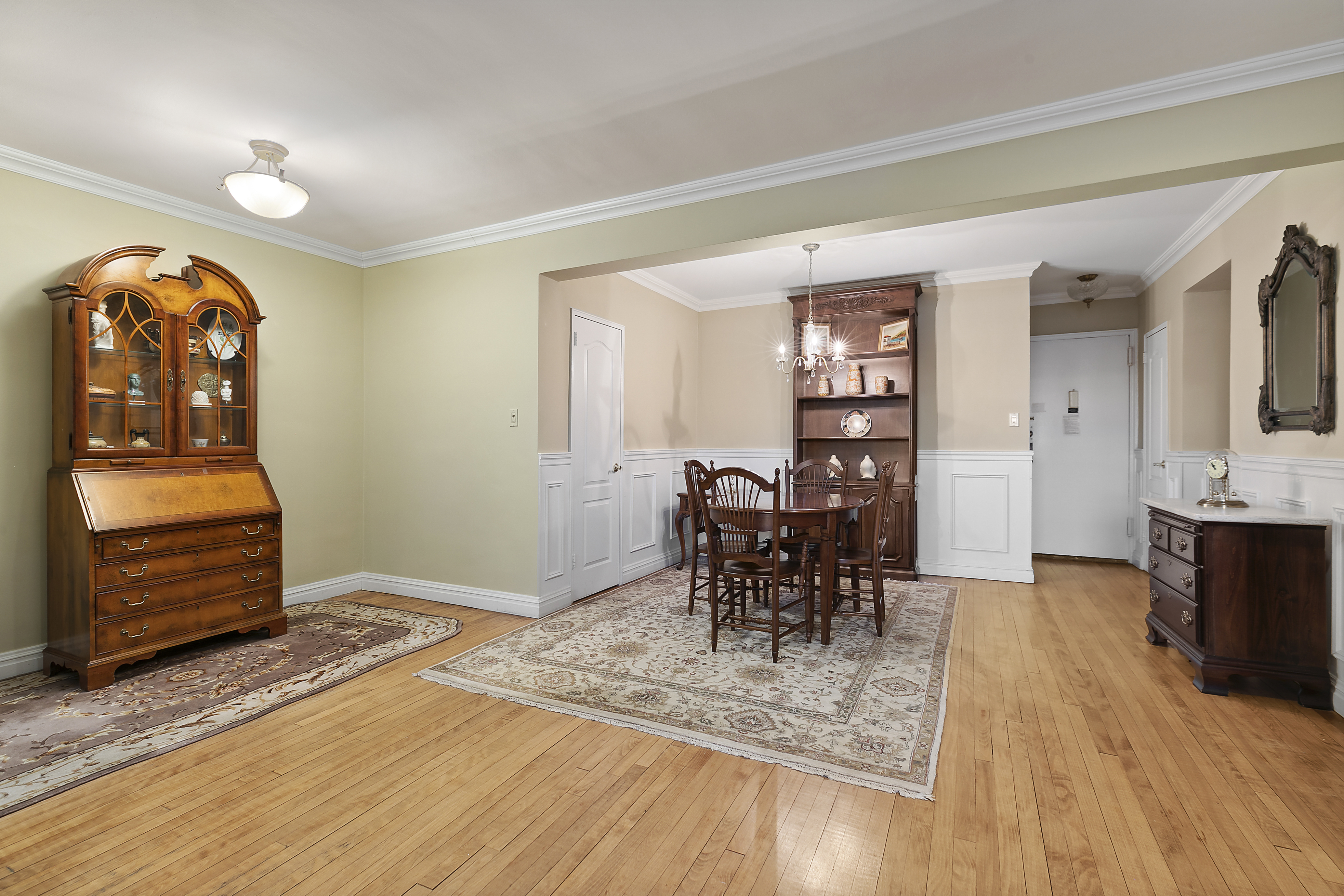 9801 Shore Road, Unit 5A Brooklyn, NY 11209 - Photo 8 of 11 a view of a livingroom with furniture and wooden floor