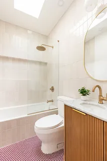 a bathroom with a sink a toilet and a bathtub