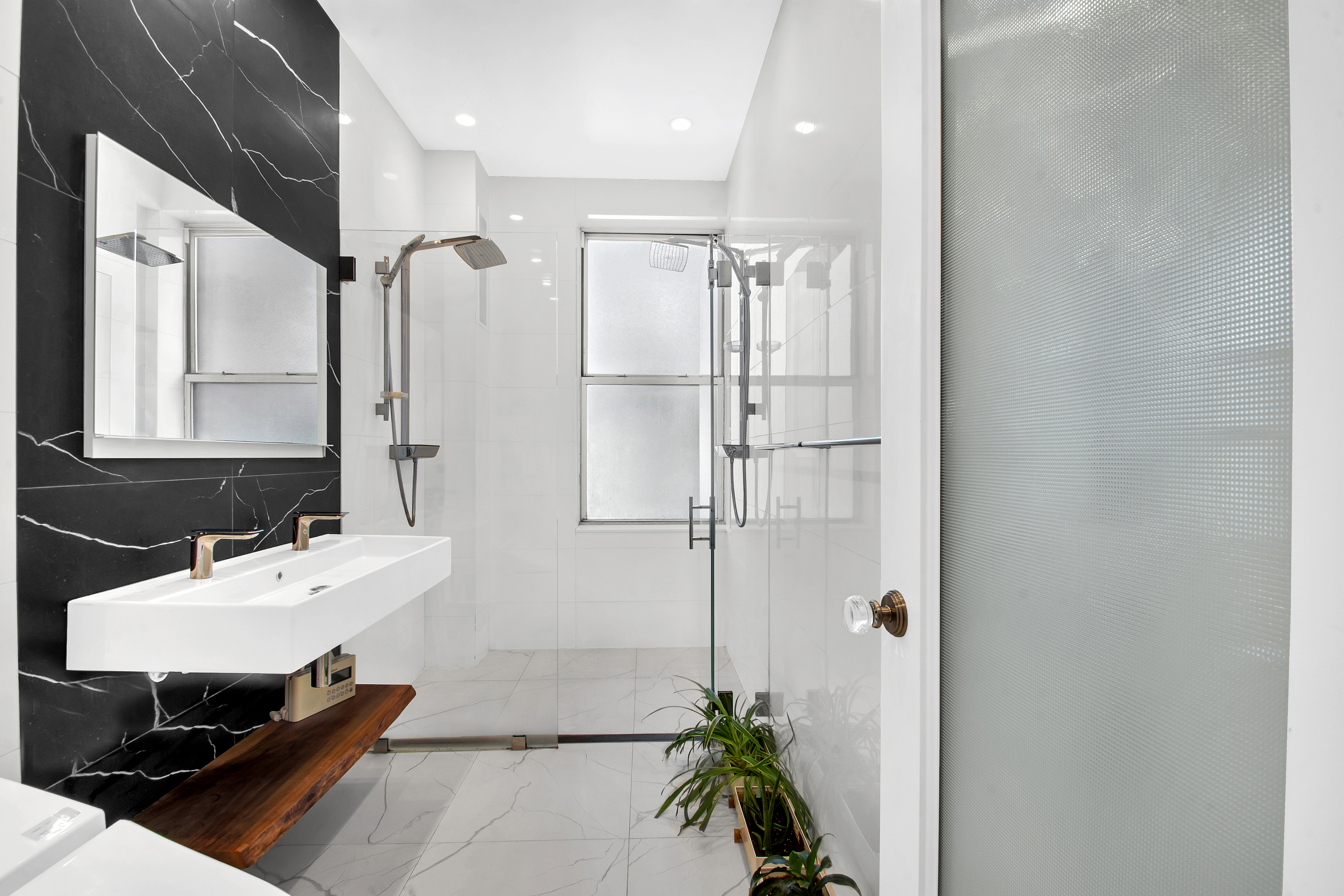 800 Riverside Drive, Unit 2E Manhattan, NY 10032 - Photo 14 of 27 a bathroom with a sink and a mirror