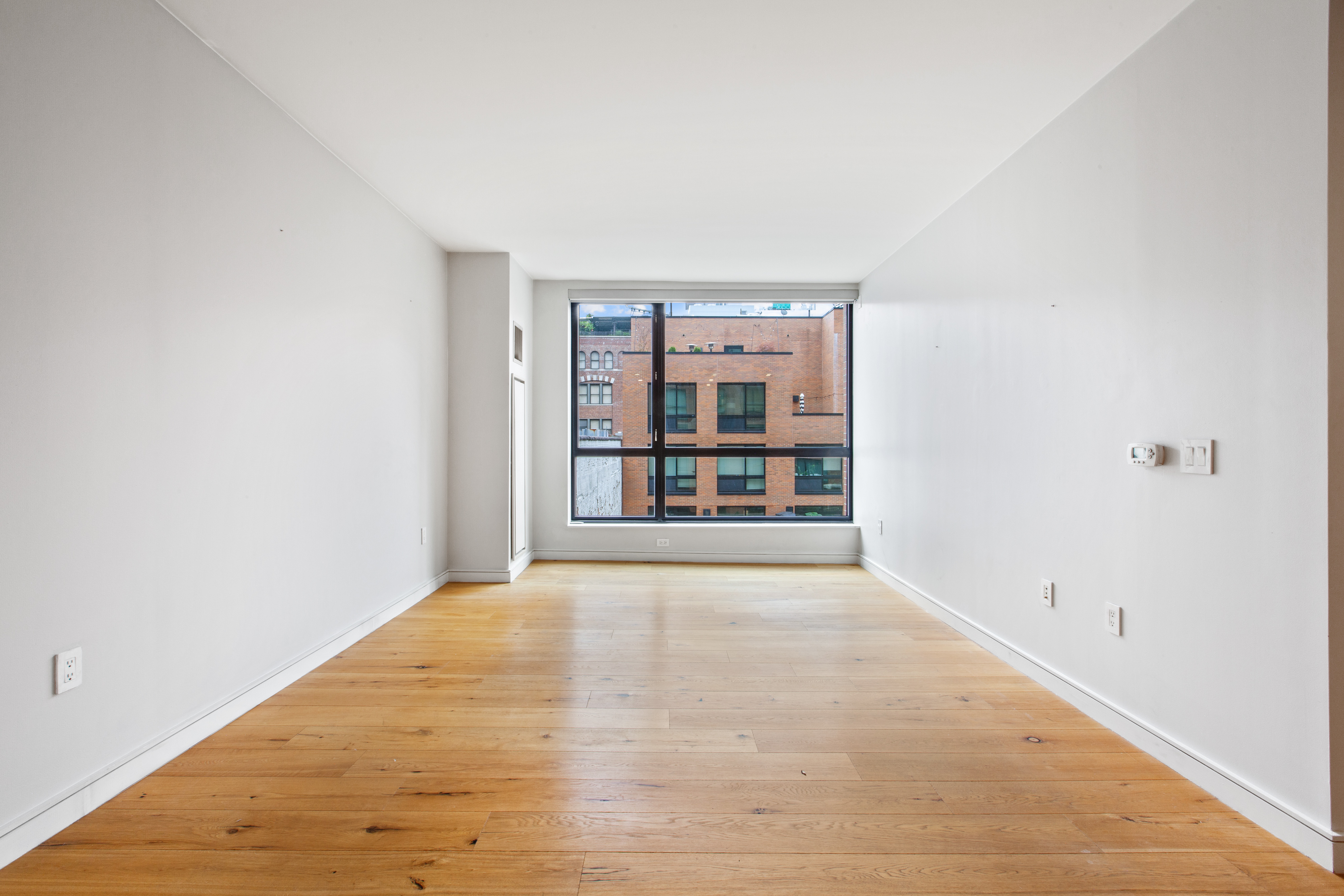 540 West 28th Street, Unit 4F Manhattan, NY 10001 - Photo 3 of 16 a view of an empty room with a window