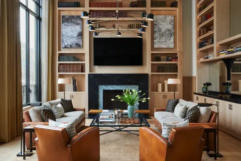 a living room with furniture and a fireplace