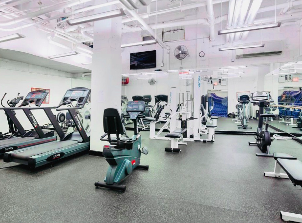 2 Sutton Place South, Unit 7F Manhattan, NY 10022 - Photo 15 of 18 a view of a room with gym equipment