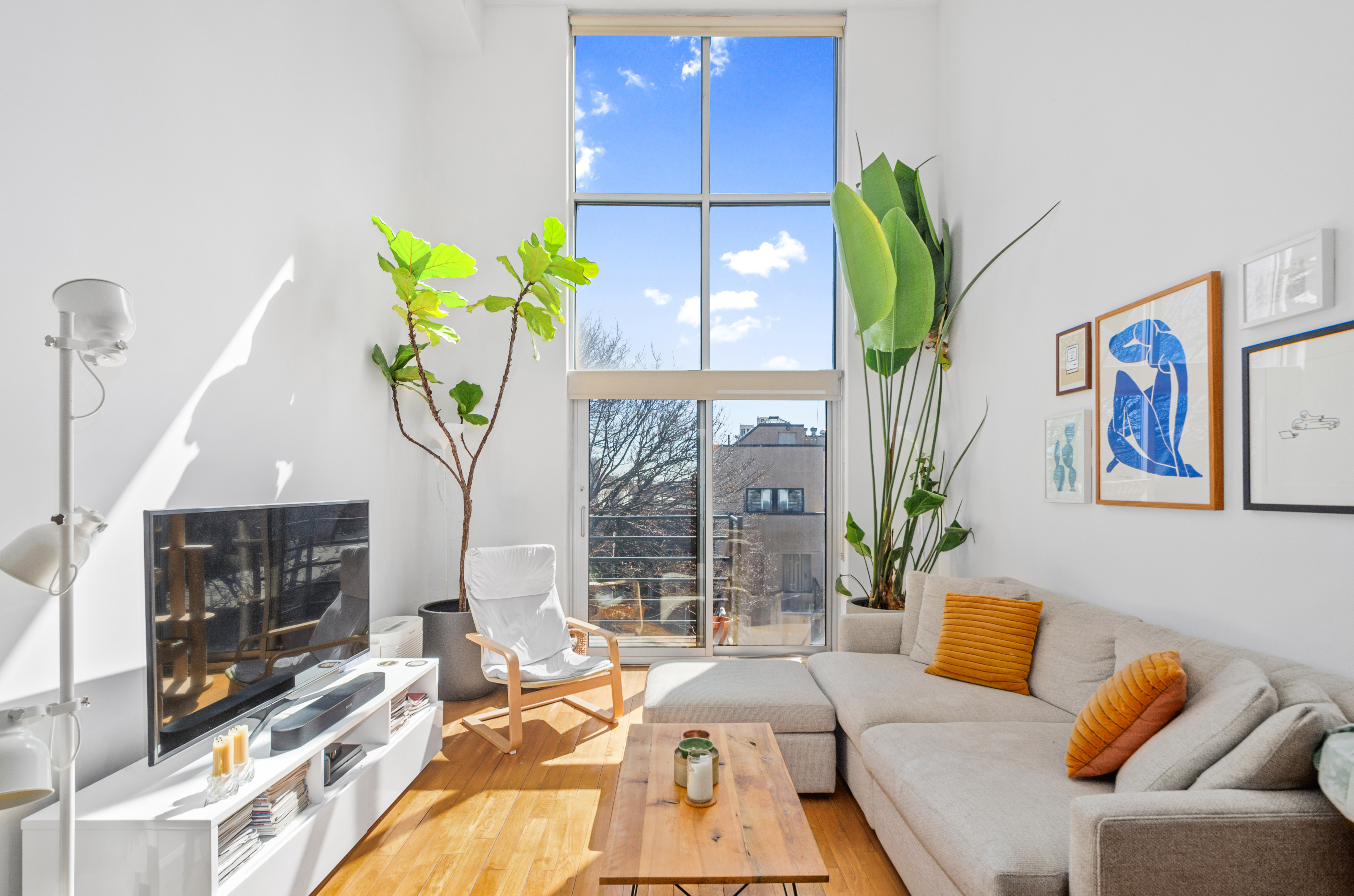 84 Eagle Street, Unit 2D Brooklyn, NY 11222 - Photo 2 of 10 a living room with patio furniture and a fireplace
