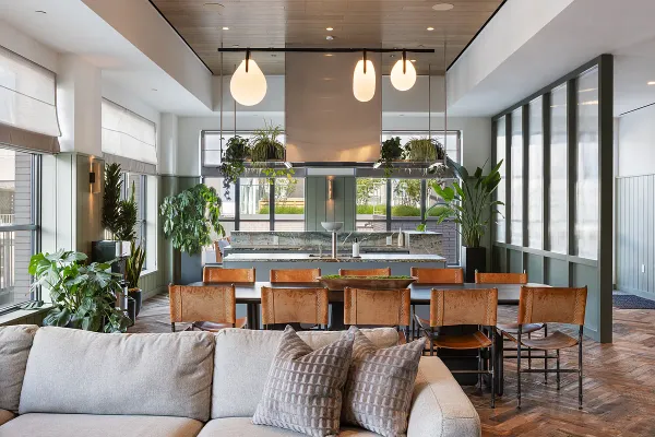 a living room with furniture a chandelier and a large window