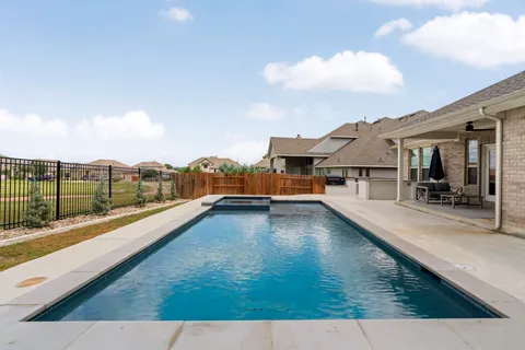 an aerial view of a house with outdoor space