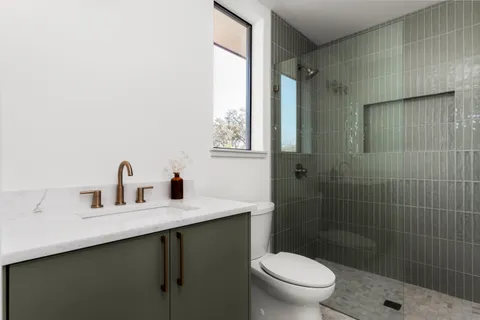 a picture of a bathroom with a shower