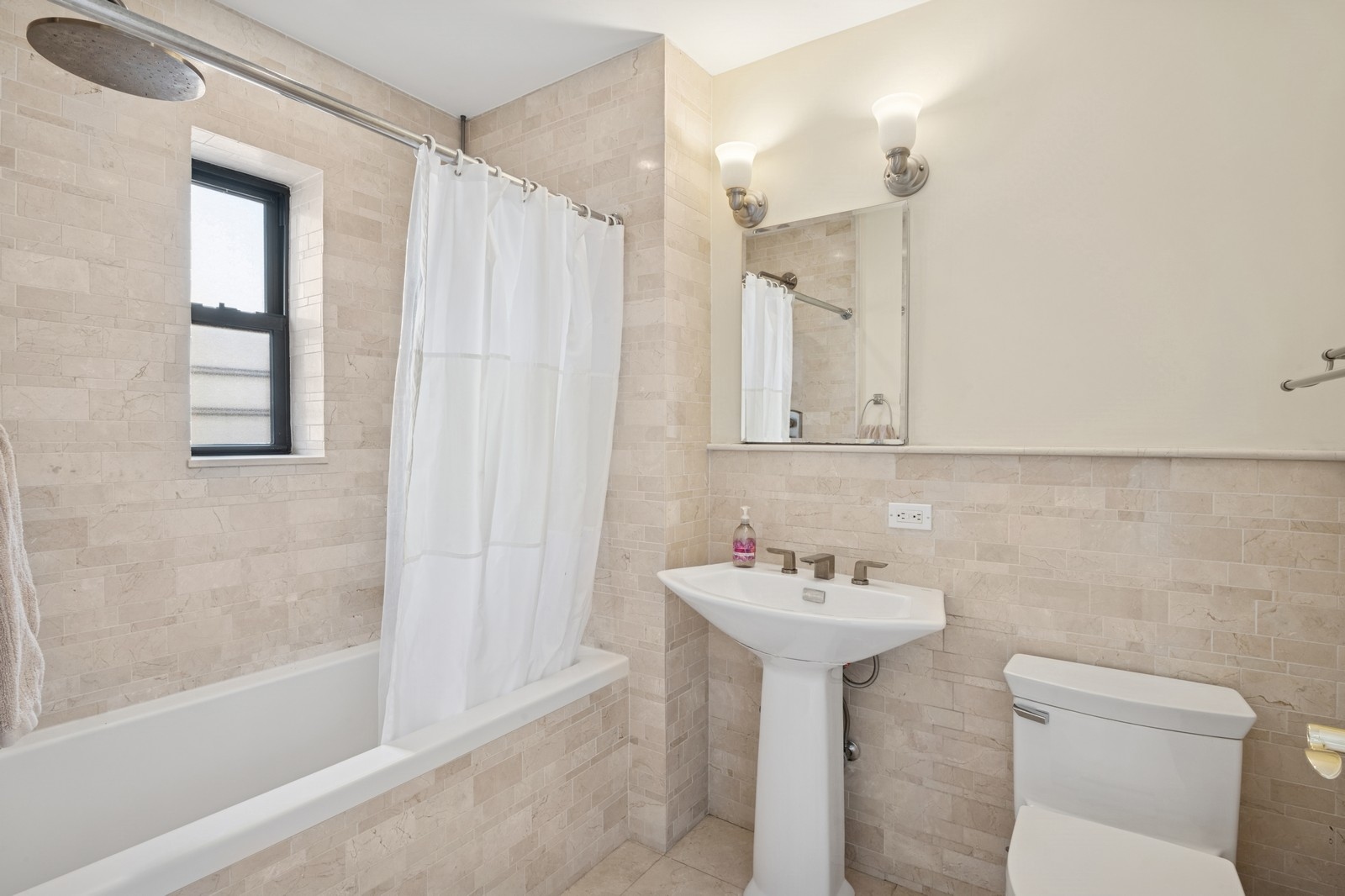 514 West End Avenue, Unit 8/9A Manhattan, NY 10024 - Photo 9 of 24 a bathroom with a sink toilet and shower