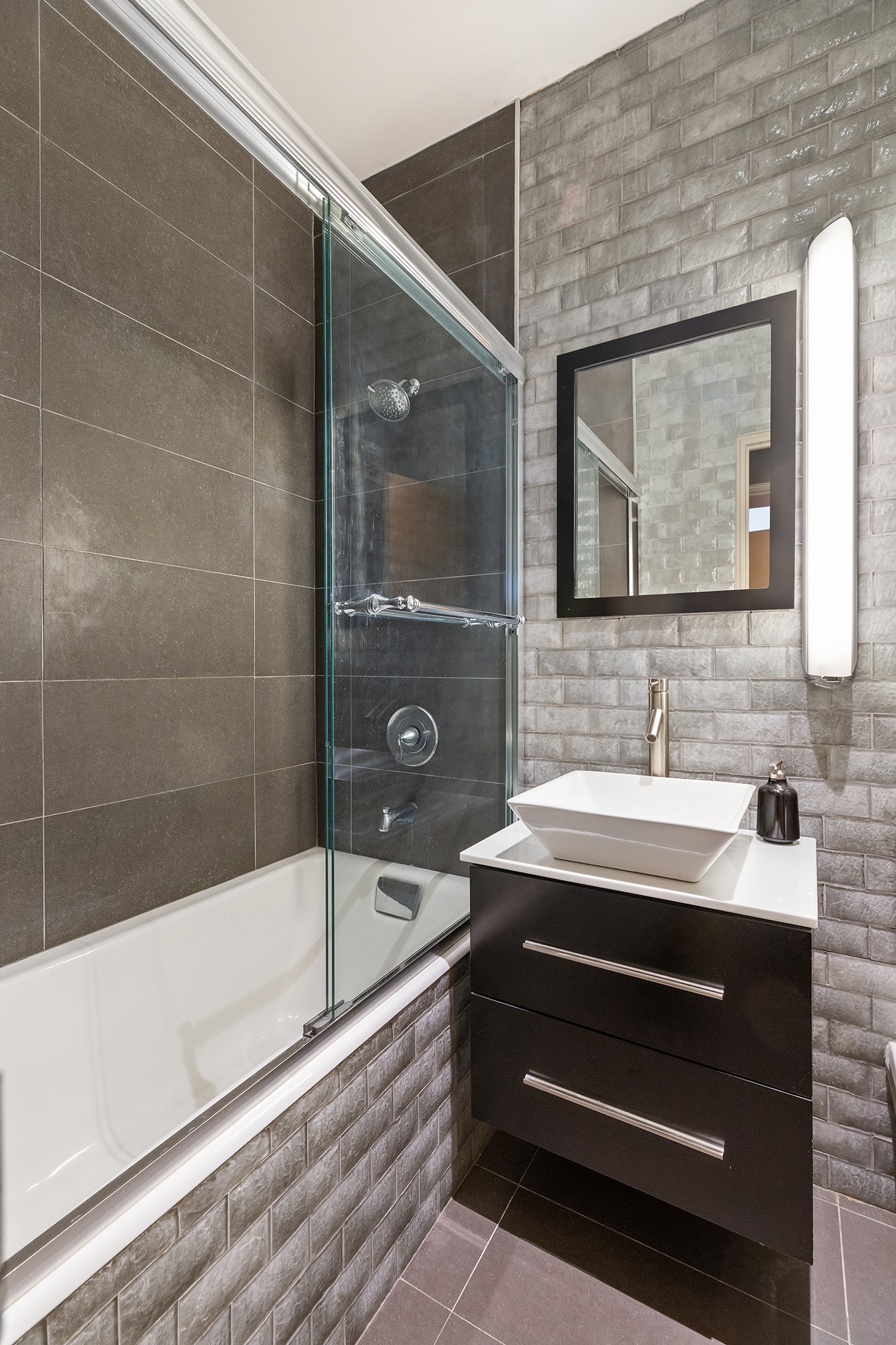 3 Hanover Square, Unit 14EF Manhattan, NY 10004 - Photo 12 of 14 a bathroom with a sink and a mirror