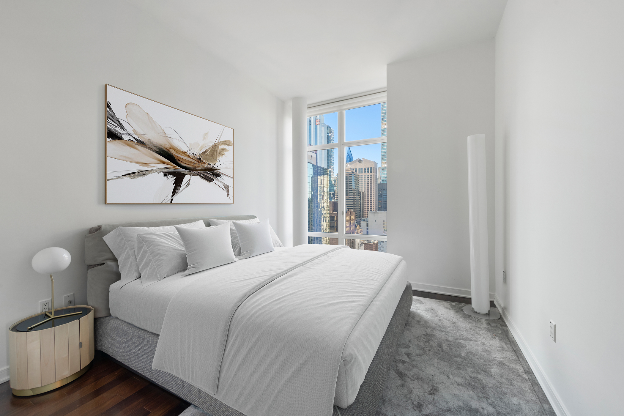 207 East 57th Street, Unit 34A Manhattan, NY 10022 - Photo 13 of 22 a bedroom with a bed and a painting on the wall