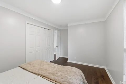 a bathroom with a sink a toilet and shower curtain