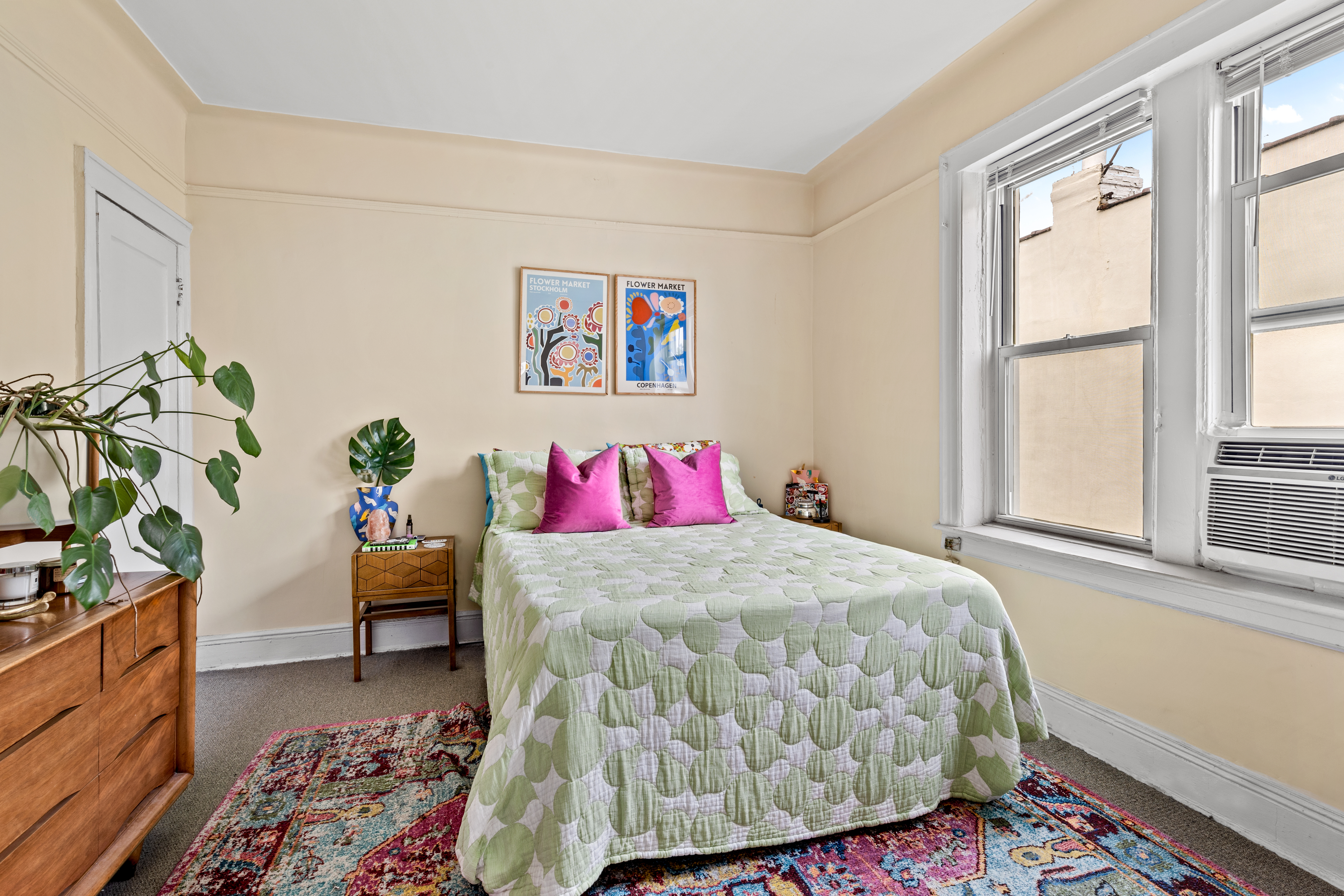 546 Prospect Avenue, Unit 2F Brooklyn, NY 11215 - Photo 2 of 4 a bedroom with a bed and a potted plant