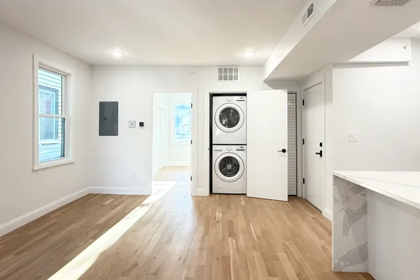 a view of a storage & utility room with wooden floor