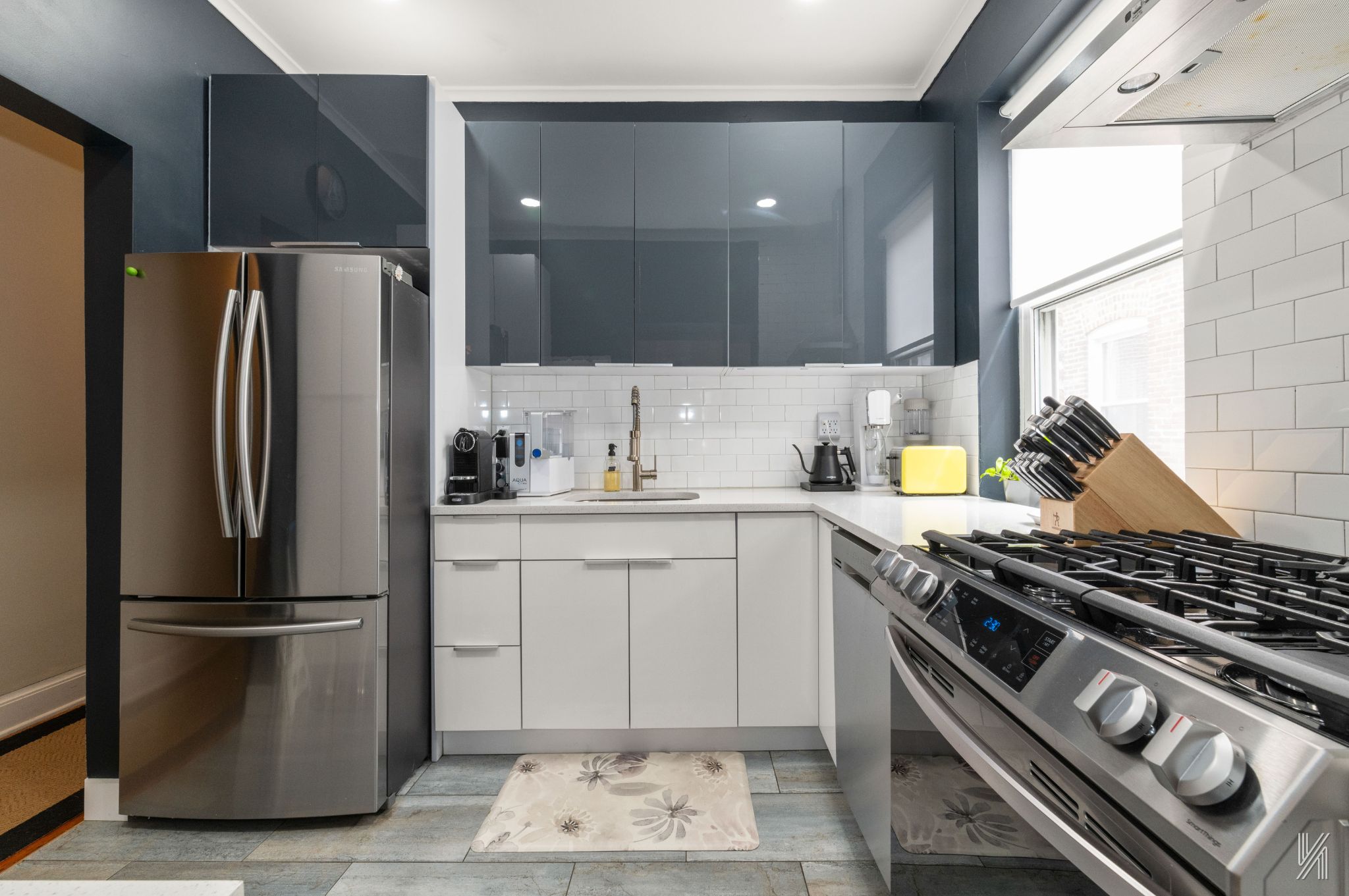 34-39 82nd Street, Unit 52 Queens, NY 11372 - Photo 5 of 18 a kitchen with a stove and a refrigerator