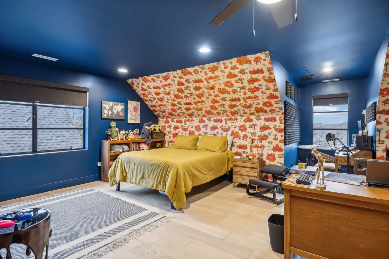 a spacious bedroom with a bed and a large window