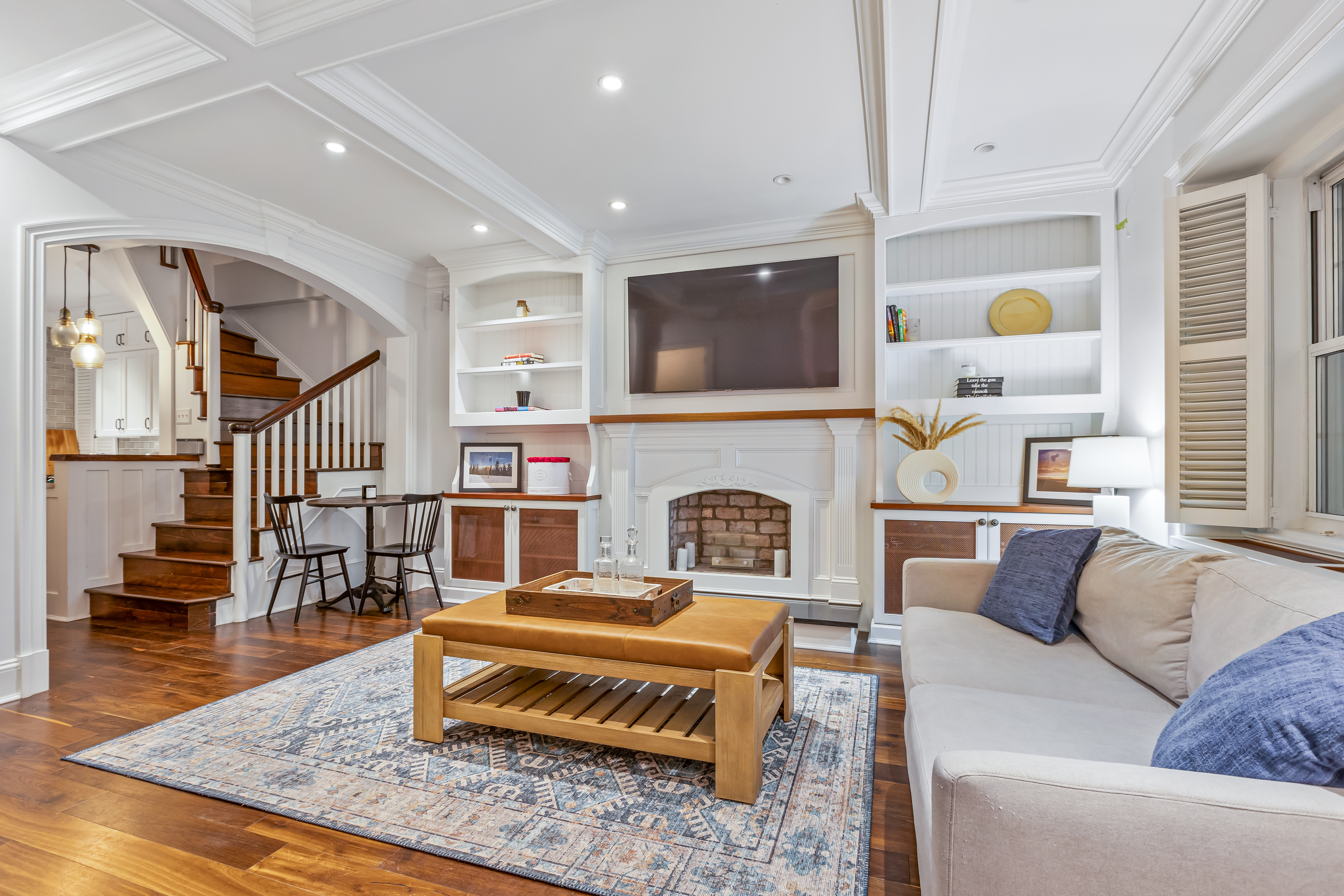 39 West 67th Street, Unit 101/201 Manhattan, NY 10023 - Photo 1 of 7 a living room with furniture and a fireplace