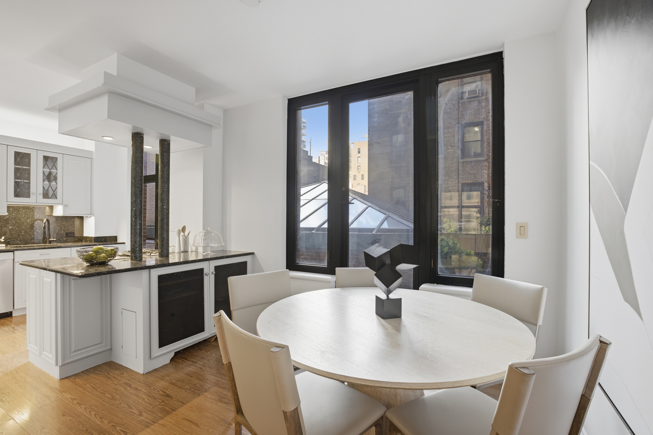 188 East 70th Street, Unit 3A Manhattan, NY 10021 - Photo 4 of 18 a view of a dining room with furniture and window