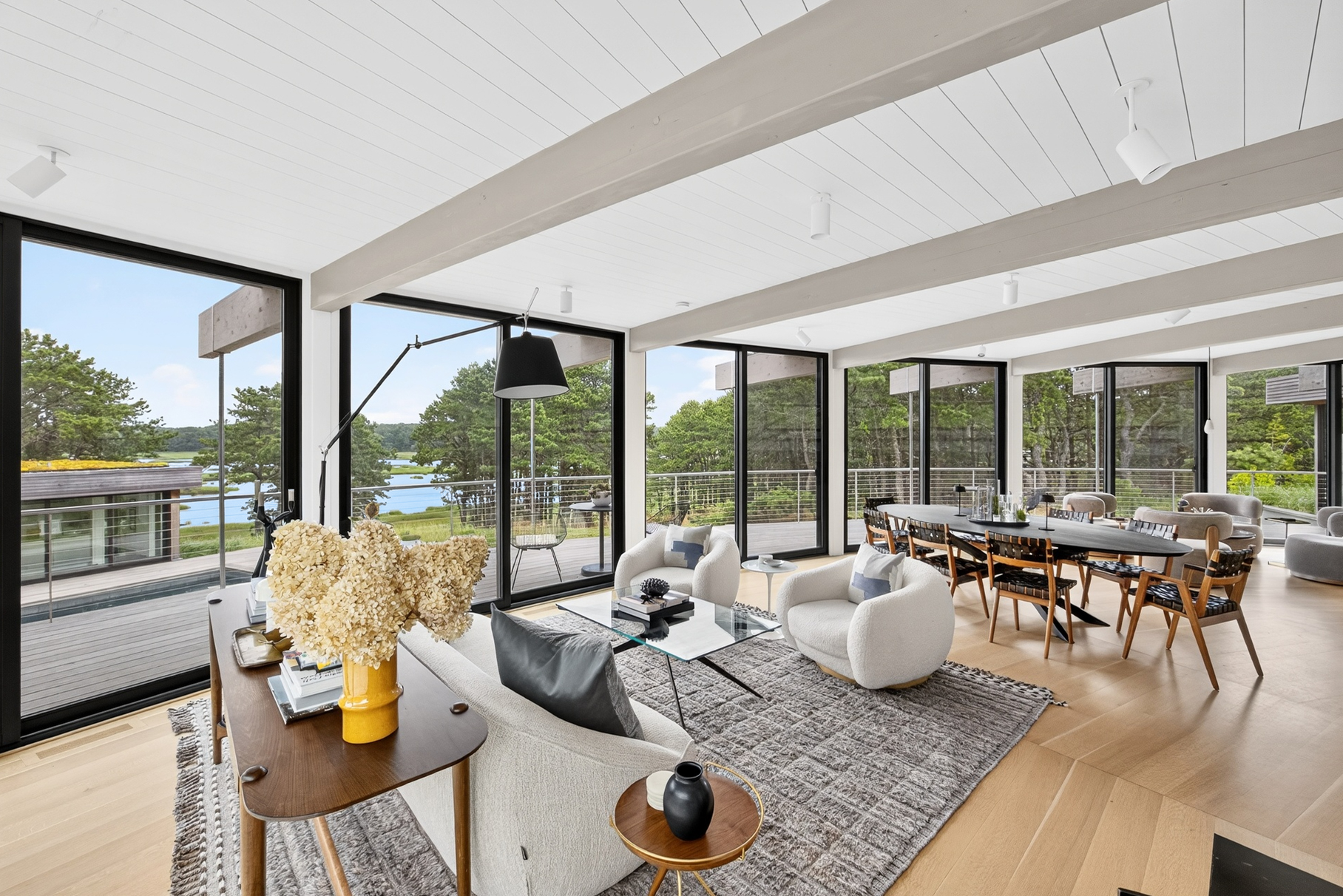 375 King Phillip Road Wellfleet, MA 02667 - Photo 4 of 27 a living room with furniture and floor to ceiling windows