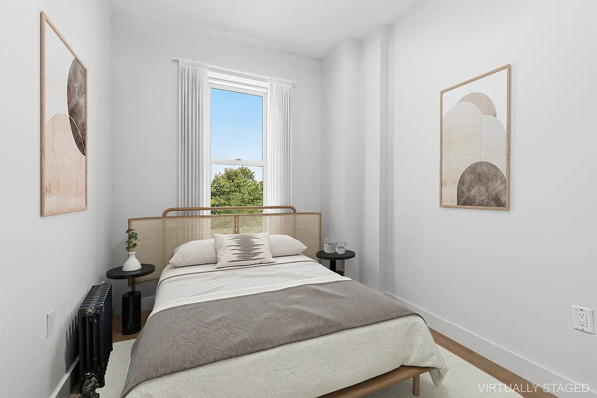 204 Smith Street, Unit 3R Brooklyn, NY 11201 - Photo 4 of 7 a bedroom with a bed and potted plant