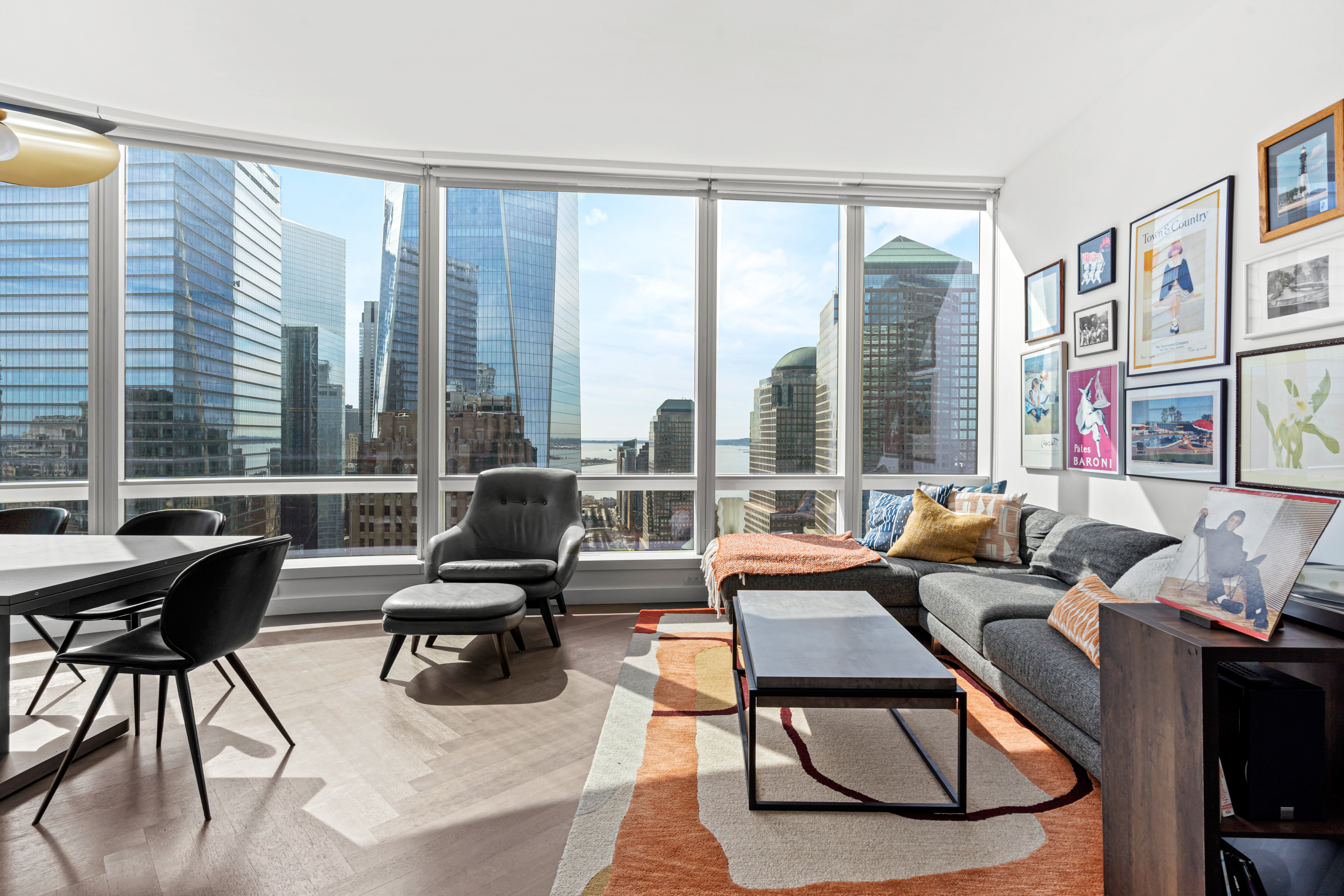 111 Murray Street, Unit 43B Manhattan, NY 10007 - Photo 3 of 17 a living room with furniture and large windows