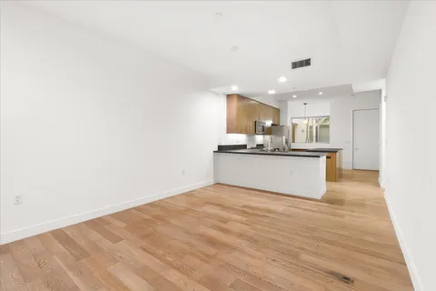 a view of kitchen with wooden floor