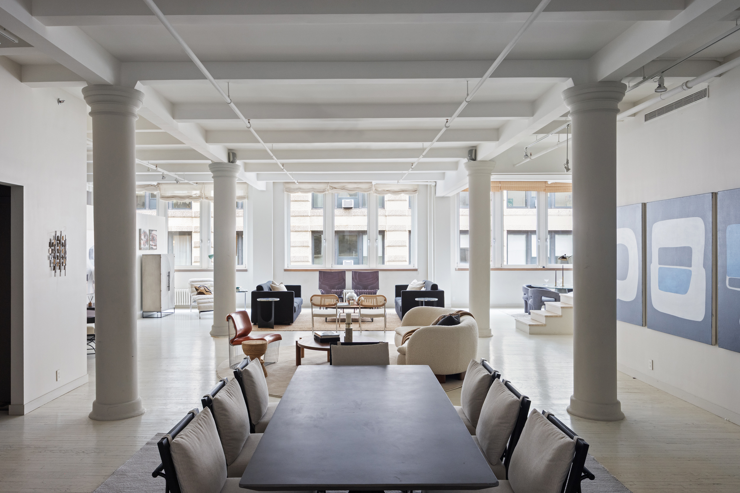 32 West 20th Street, Unit 5 Manhattan, NY 10011 - Photo 6 of 18 a living room with furniture large window and wooden floor