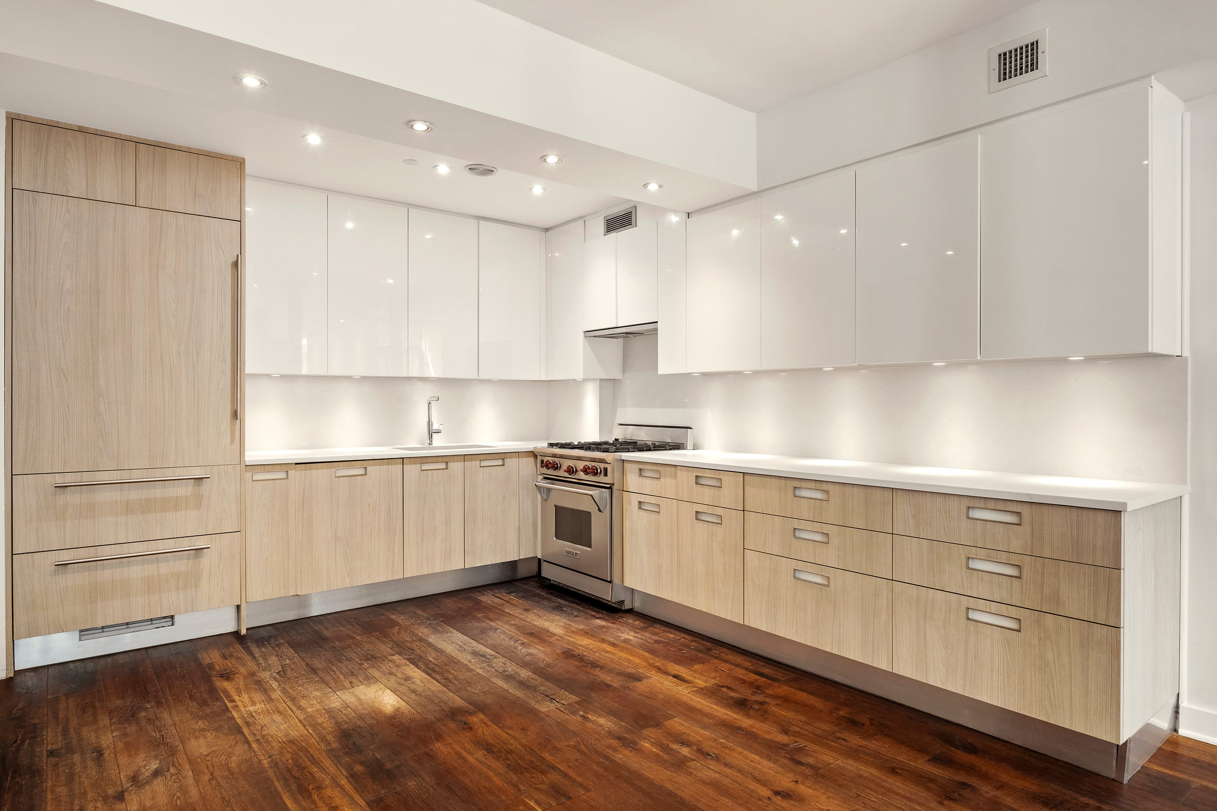 401 Hicks Street, Unit A1B Brooklyn, NY 11201 - Photo 3 of 14 a kitchen with granite countertop white cabinets and white appliances